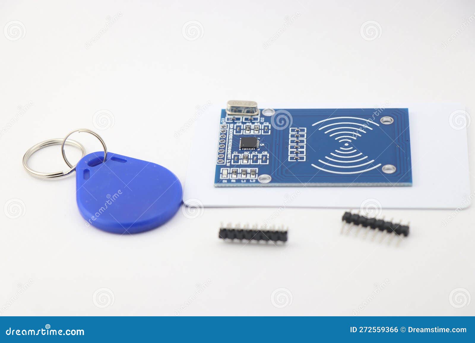 RFID Chip Sensor with Its Key Tag and Pins for Soldering on the Board