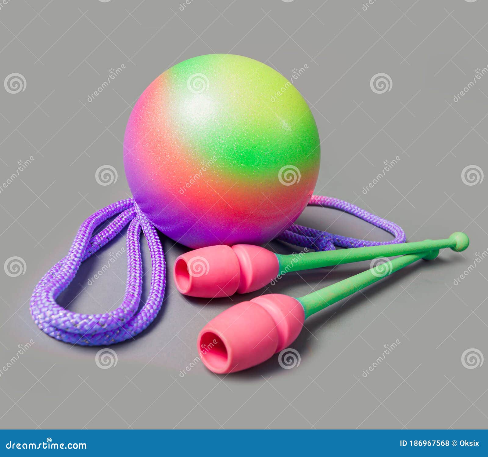 Rhythmic Gymnastics Equipment on Grey Background. Green Ball, Mace and Rope  for Gymnastics Stock Photo - Image of isolated, lifestyle: 186967568