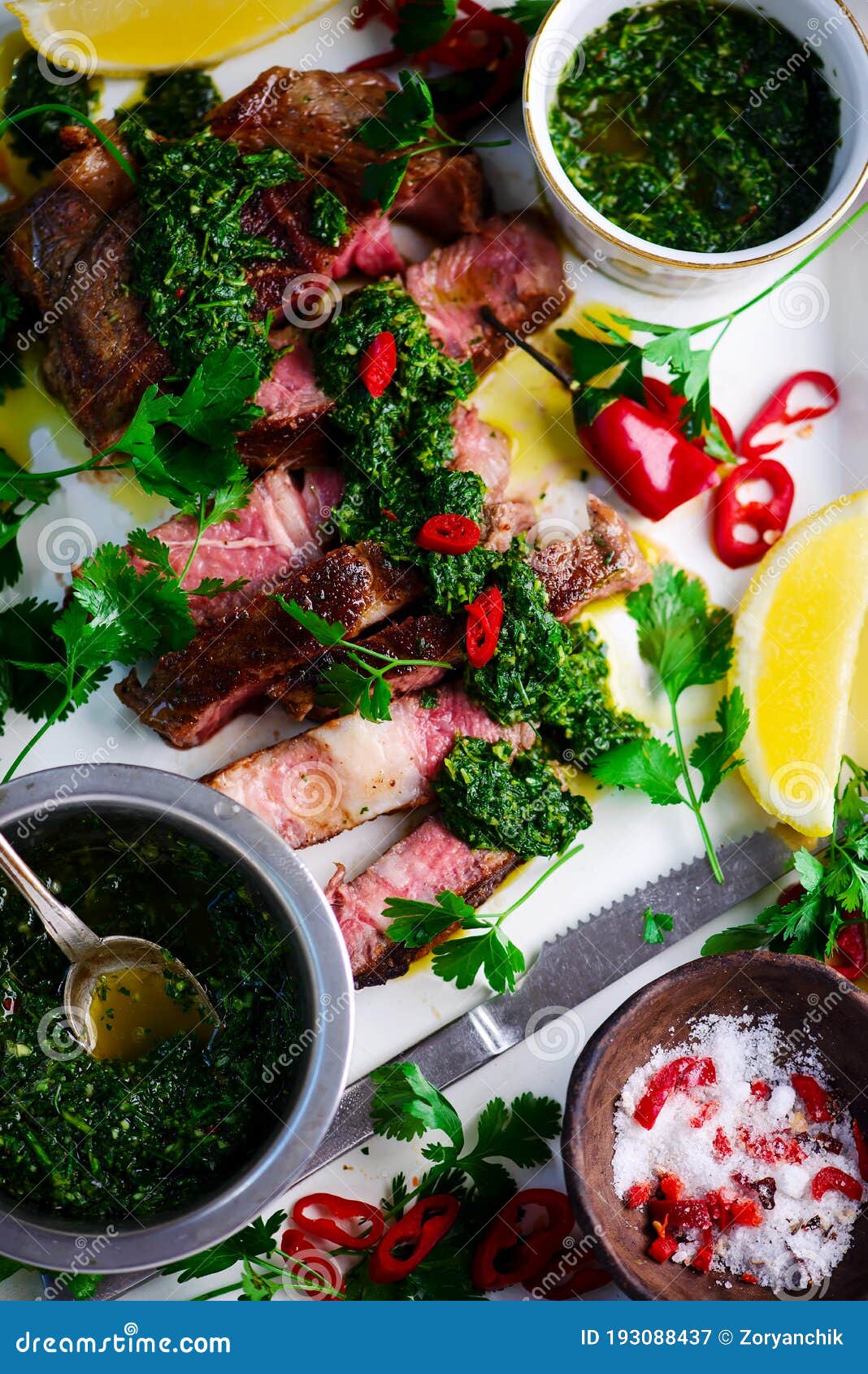 Rib Eye Steak with Chimmichurri Sauce. Stock Image Image of onion