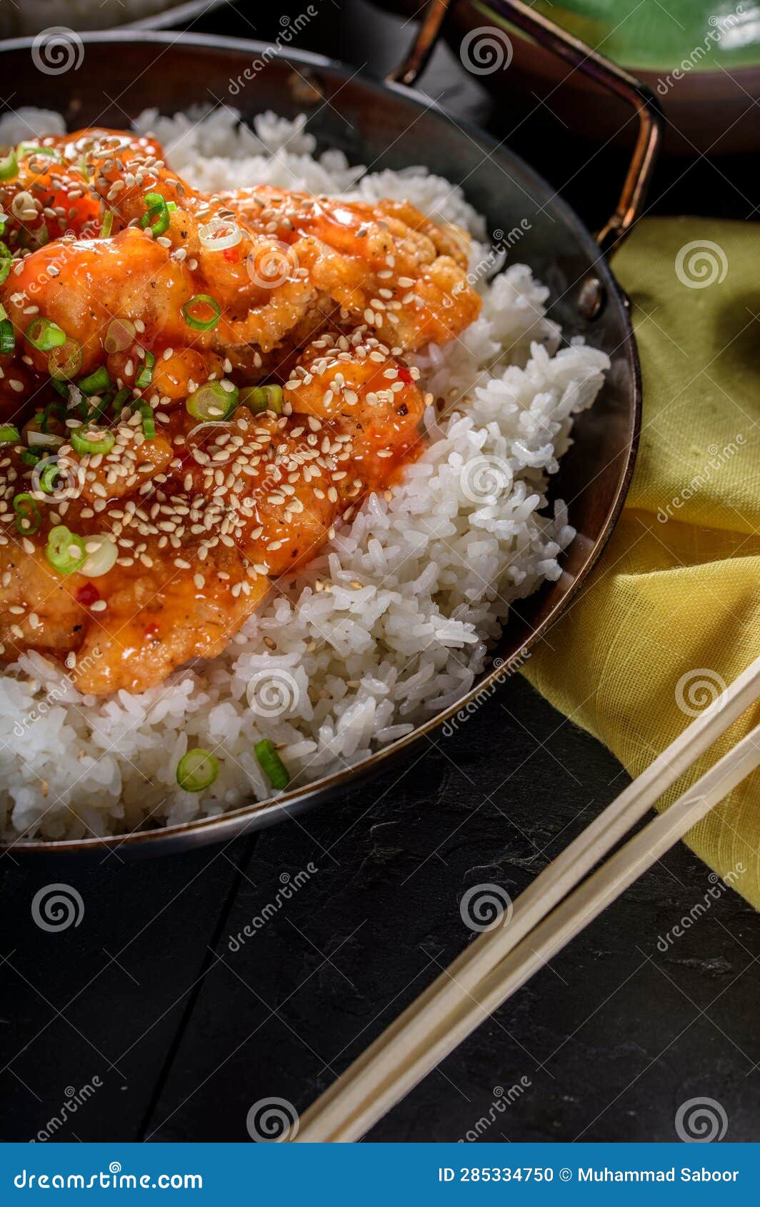 DeepFried Orange Chicken Served on a Bed of Steamed White Rice