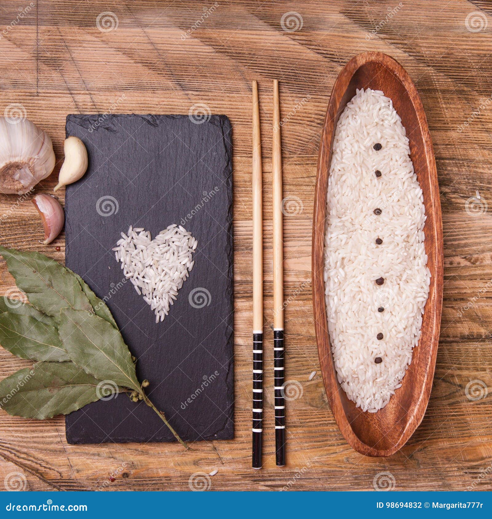 Rice in Bowl with Garlic and Bay Leaf, Top View Stock Photo Image of