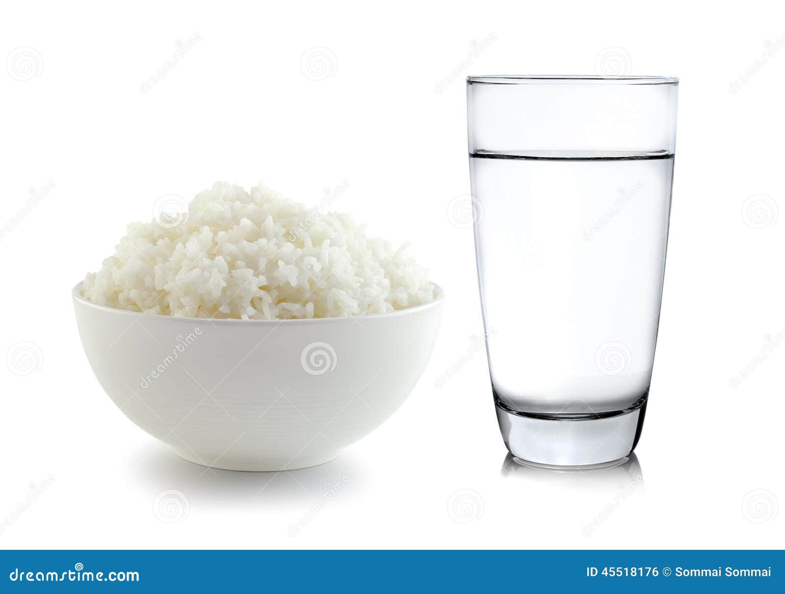 Rice In A Bowl And Glass Of Water On White Background Stock Photo