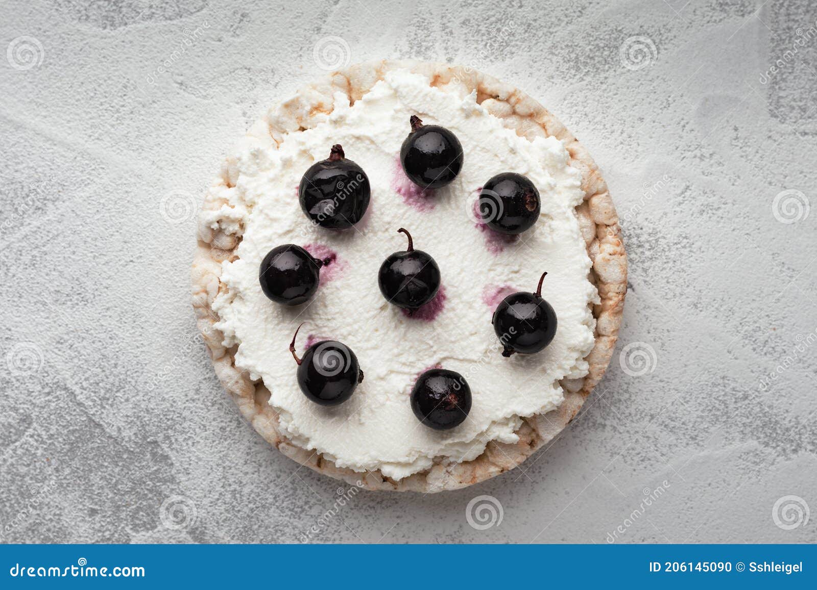 Rice Cakes with Cream Cheese and Black Currant Top View Close Up Stock