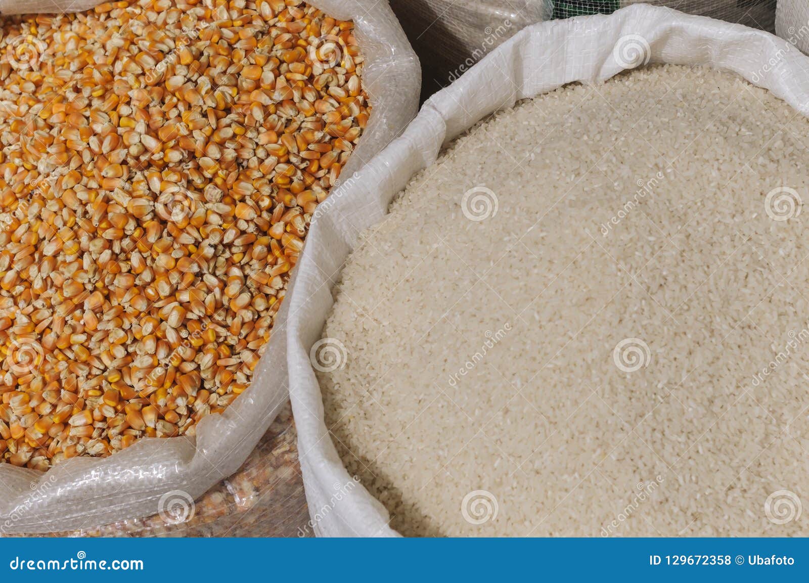 Rice and corn in sacks stock photo. Image of rice, drink 129672358
