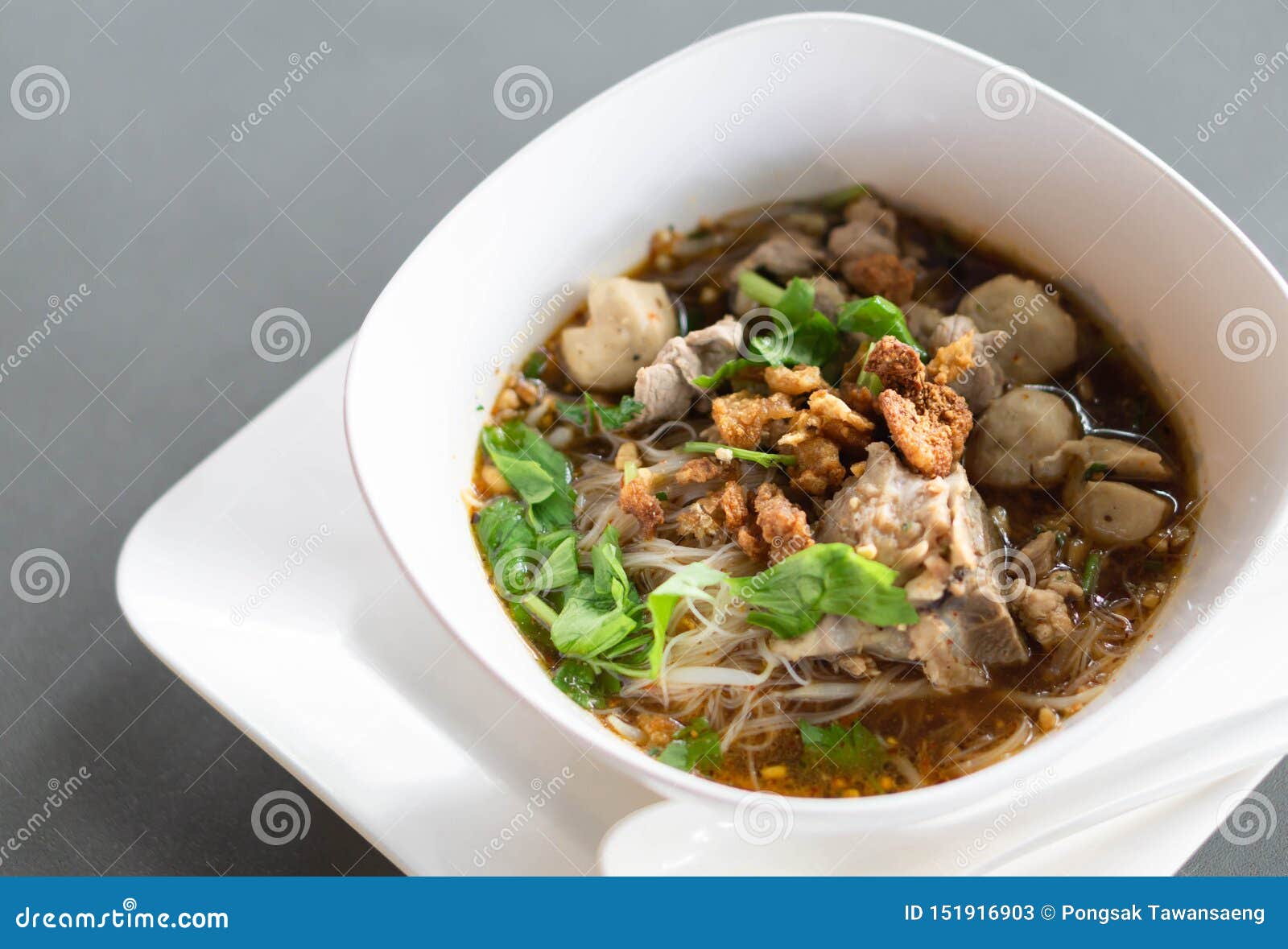 Rice Noodle Soup with Cooked Liver in Bowl on Table, Selective Focus