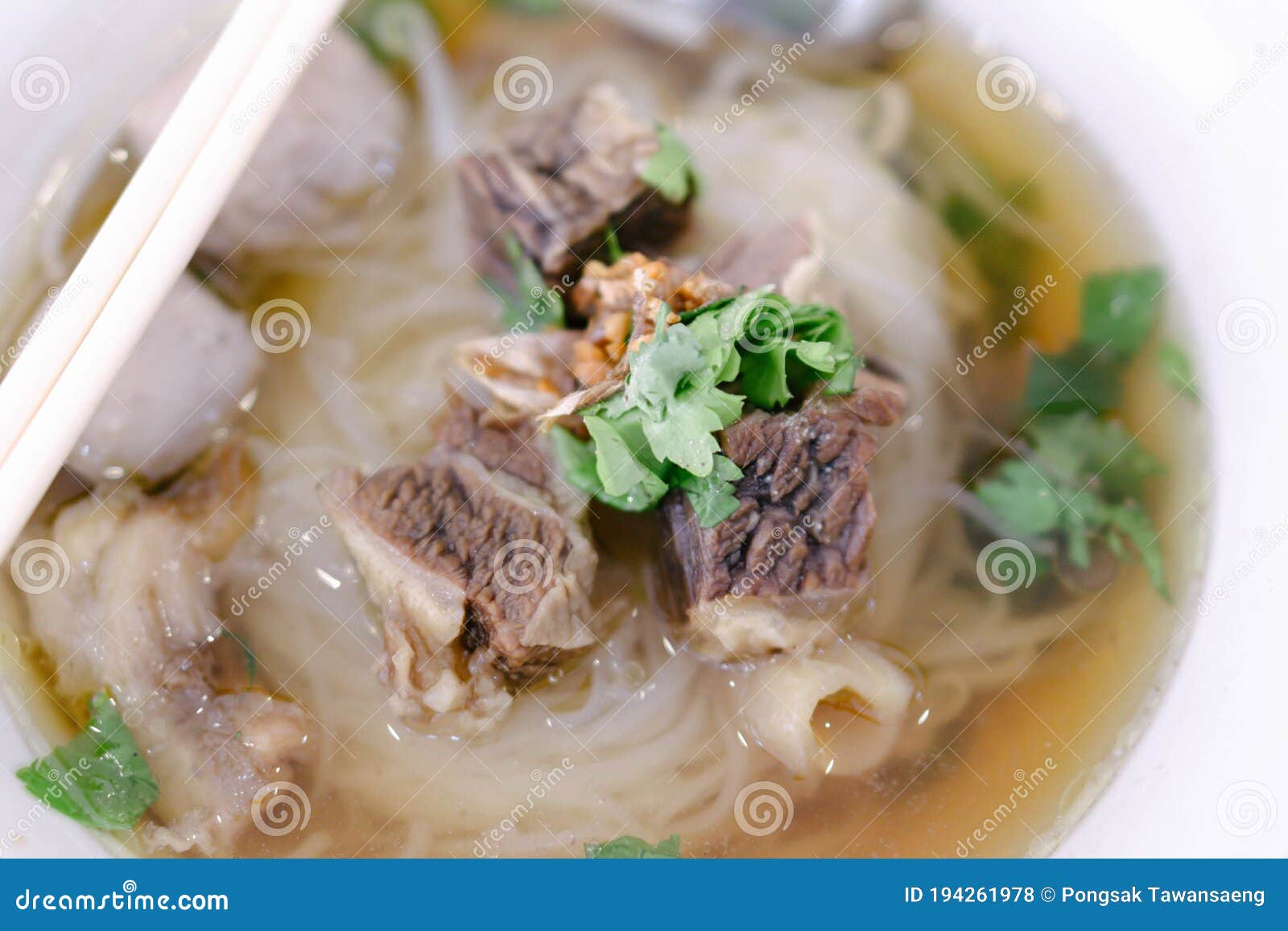 Rice Noodle Soup with Cooked Liver in Bowl on Table, Selective Focus