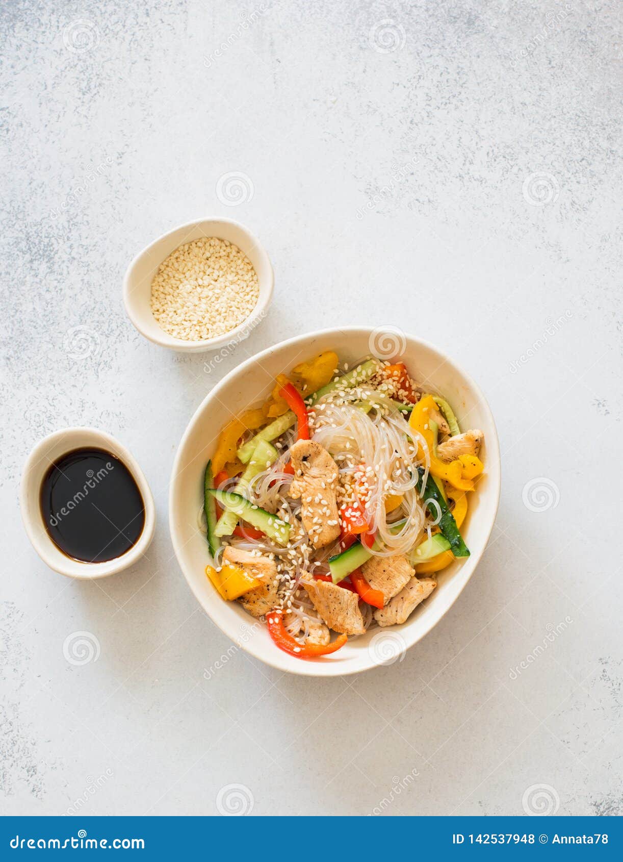 Rice Noodles with Vegetables, Chicken Meat and Sesame Stock Photo