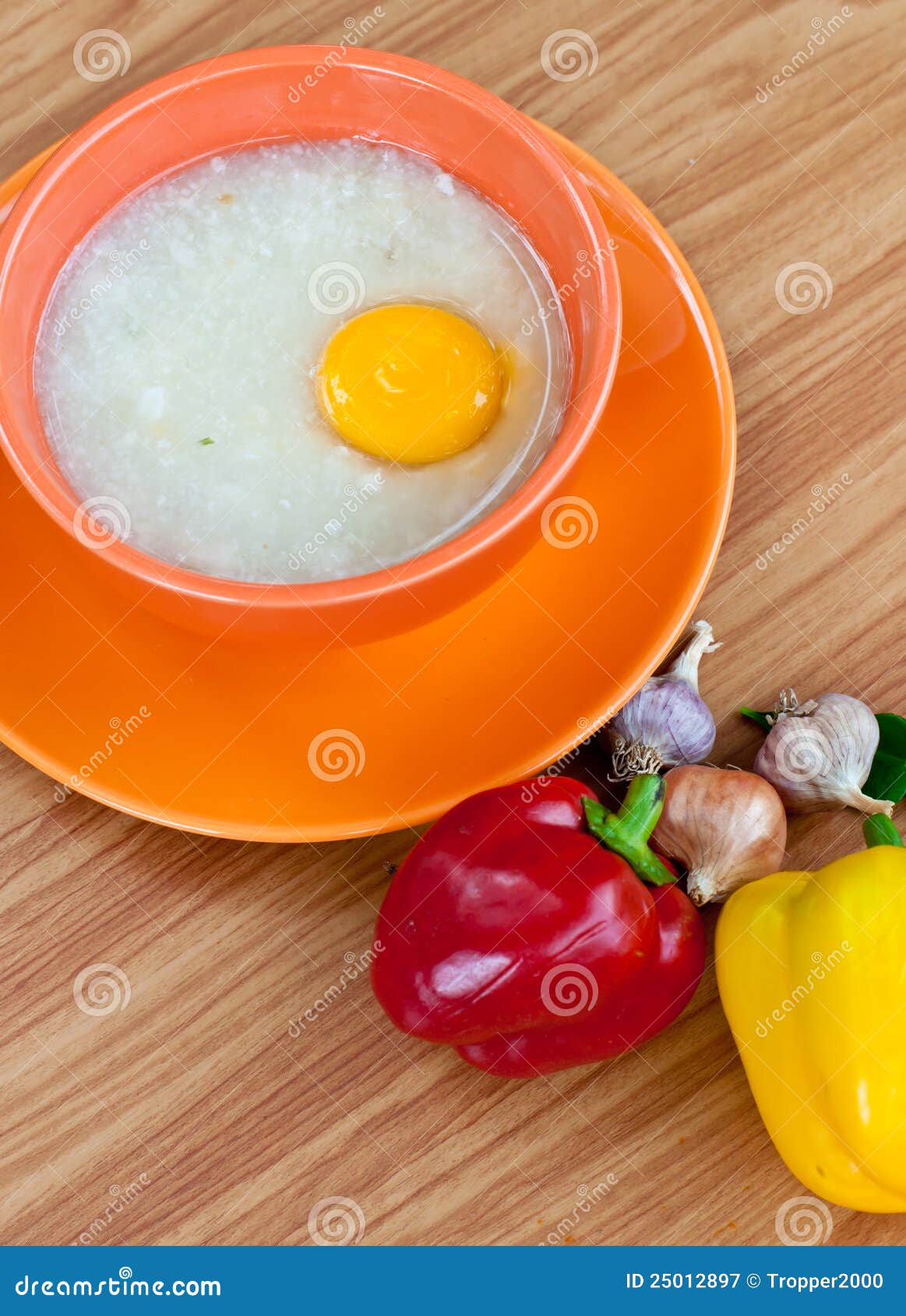 Rice Porridge with Egg in Orange Bowl. Stock Image Image of grain