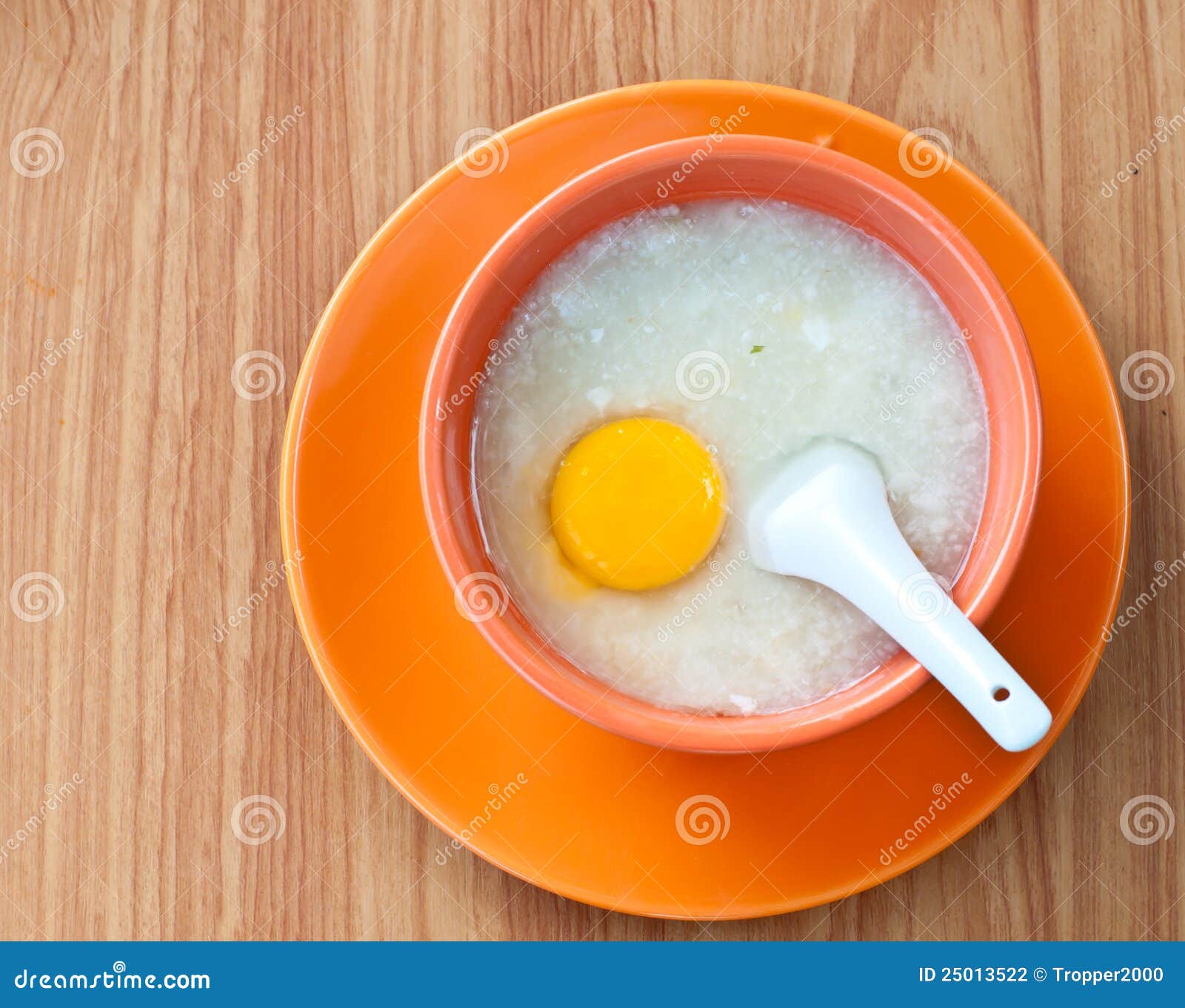 Rice Porridge with Egg in Orange Bowl. Stock Photo Image of protein