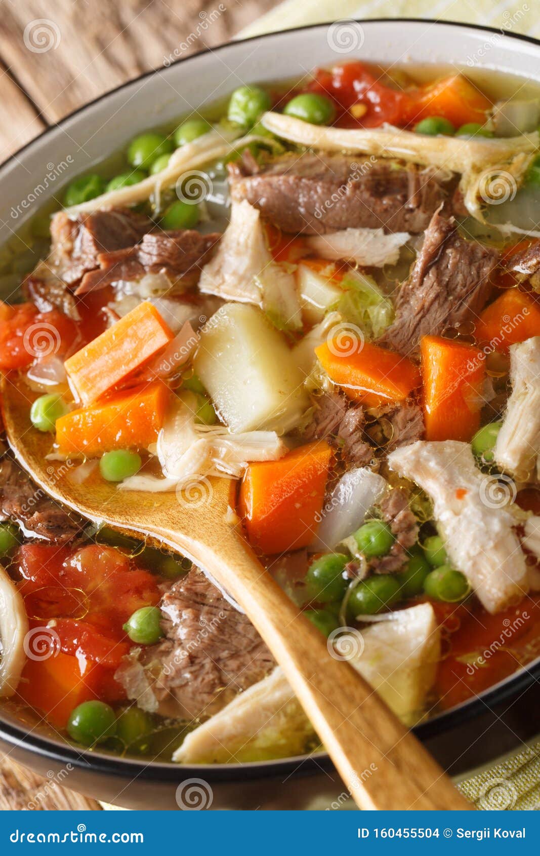 Rich Booyah Soup with Vegetables and Several Types of Meat Close-up in a  Bowl. Vertical Stock Photo - Image of bowl, american: 160455504