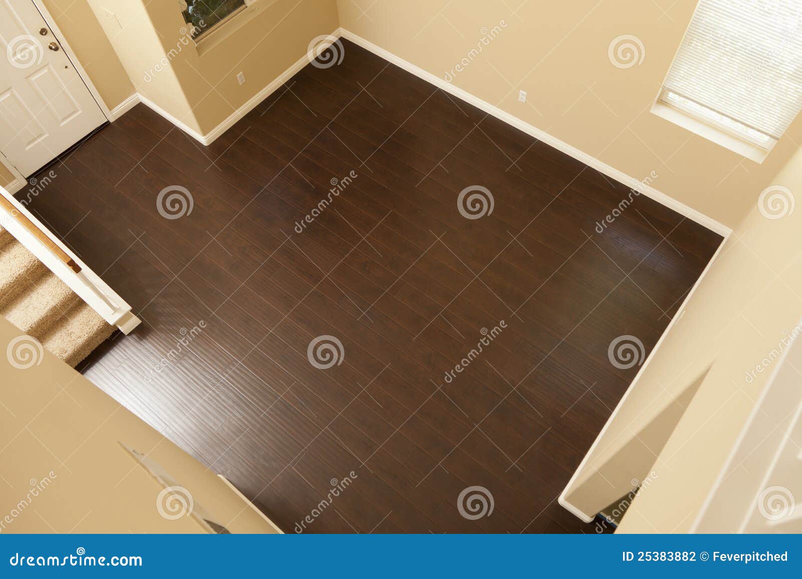 rich brown laminate flooring and baseboards in home