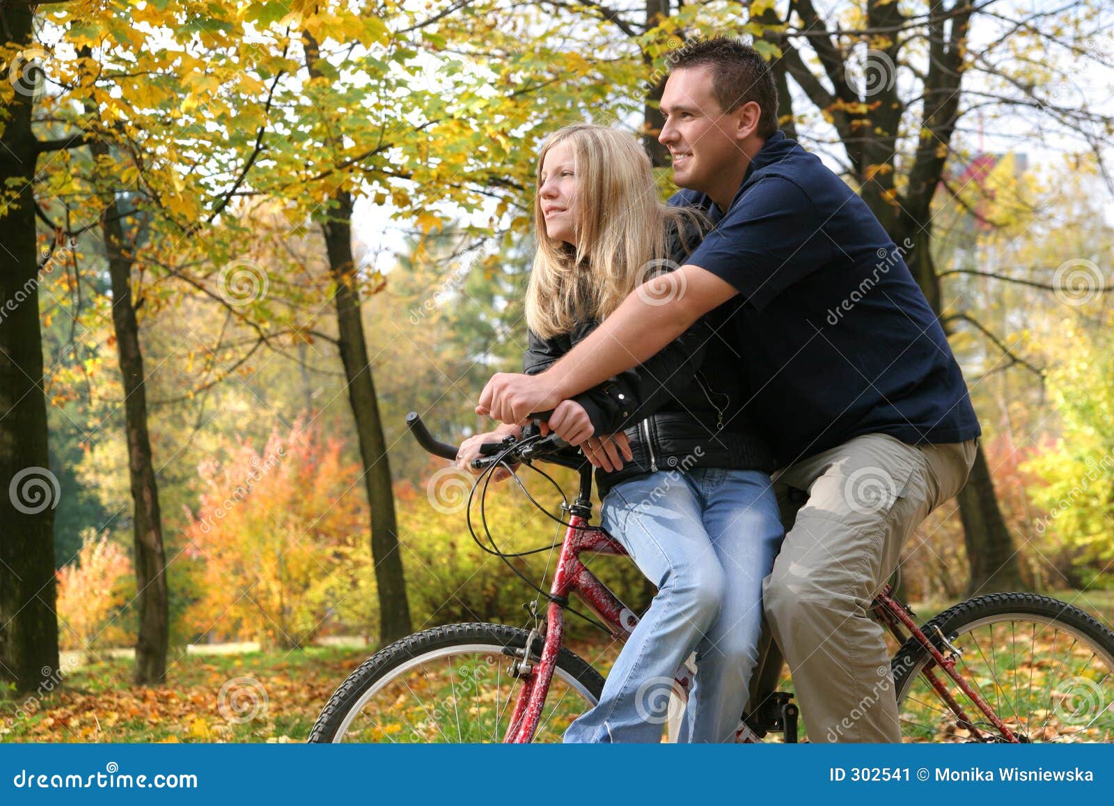 two people riding a bike