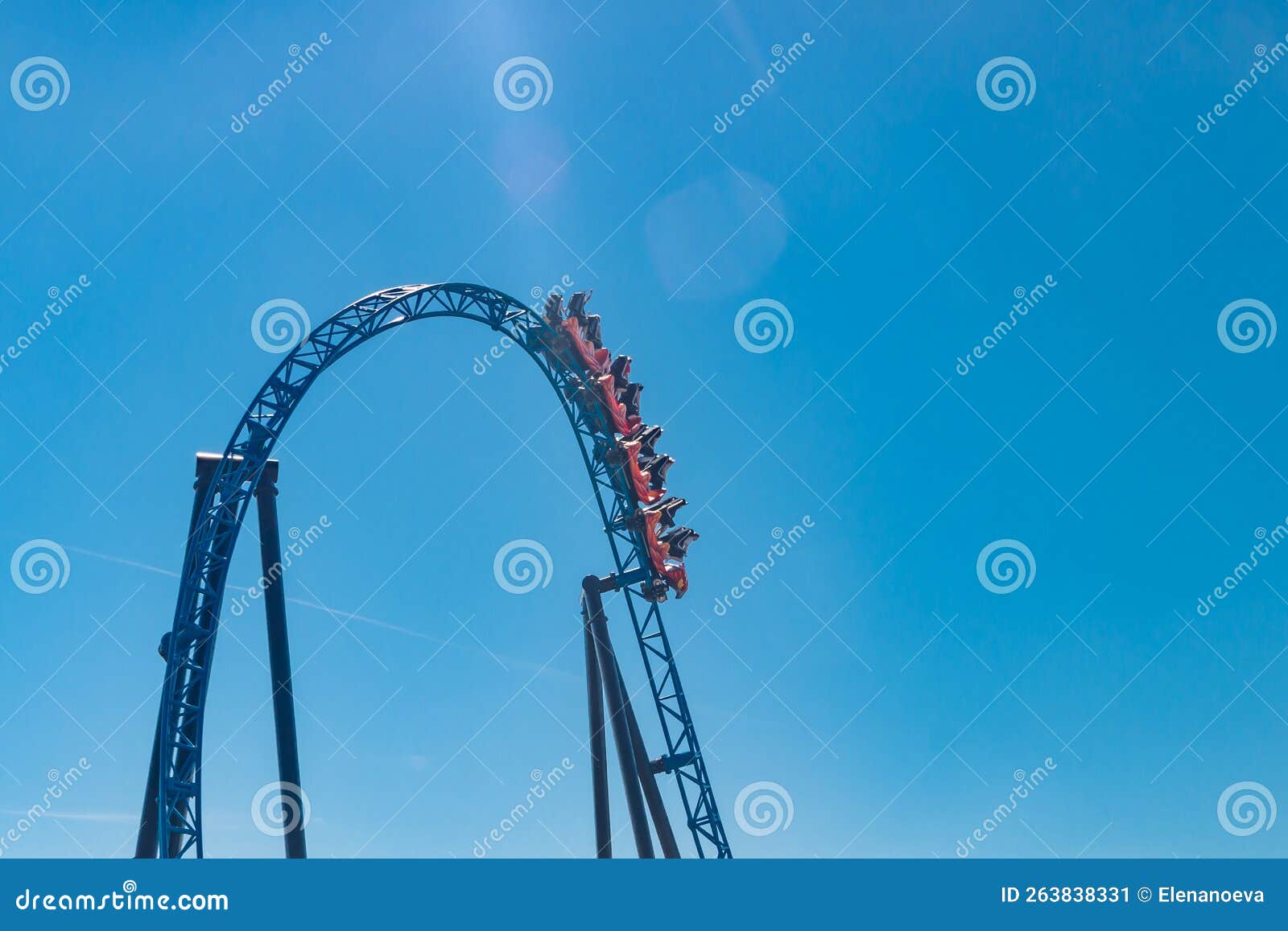 Ride Roller Coaster in Blurred Motion on Sky Background in Amusement