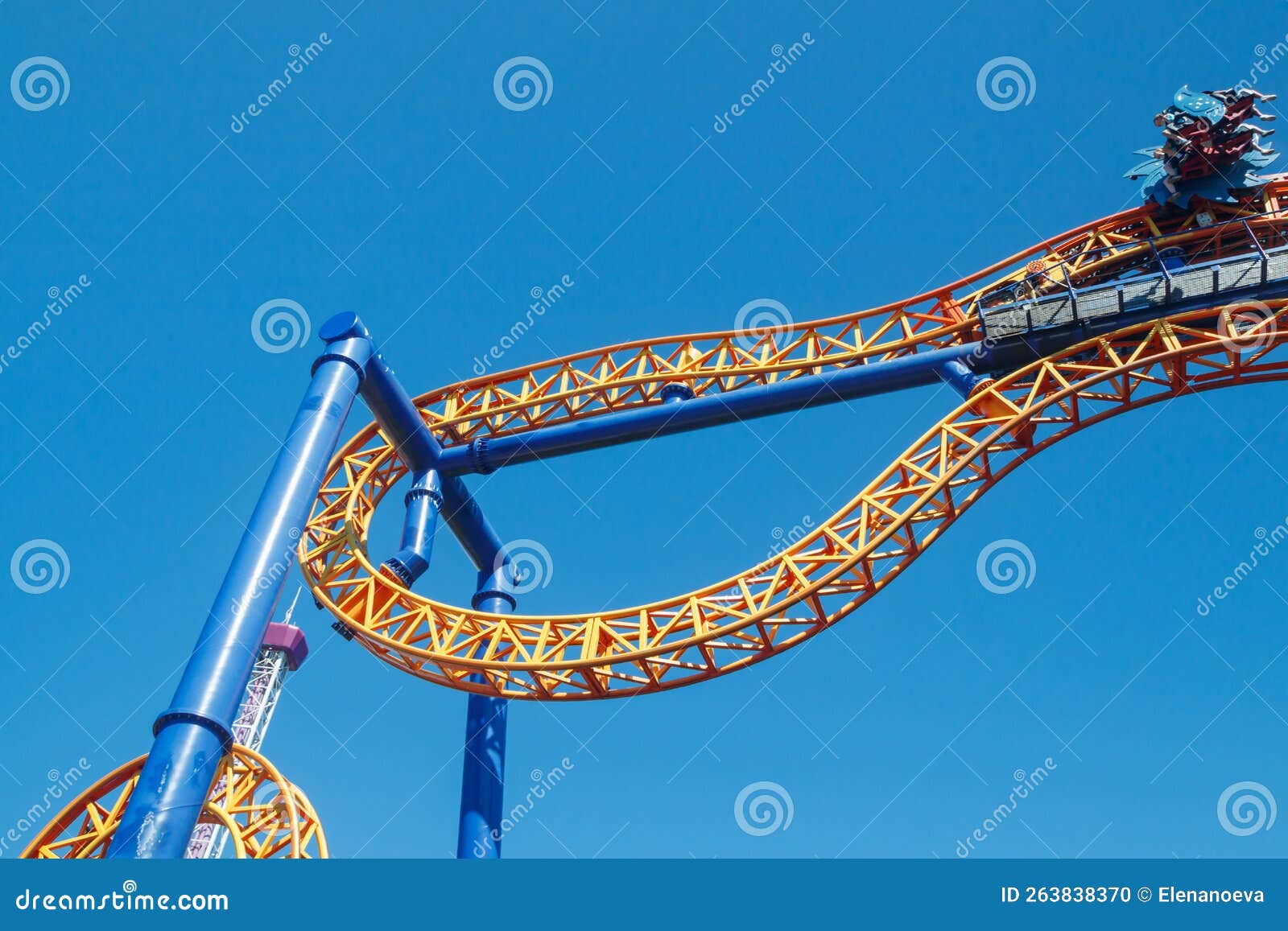 Ride Roller Coaster in Blurred Motion on Sky Background in Amusement
