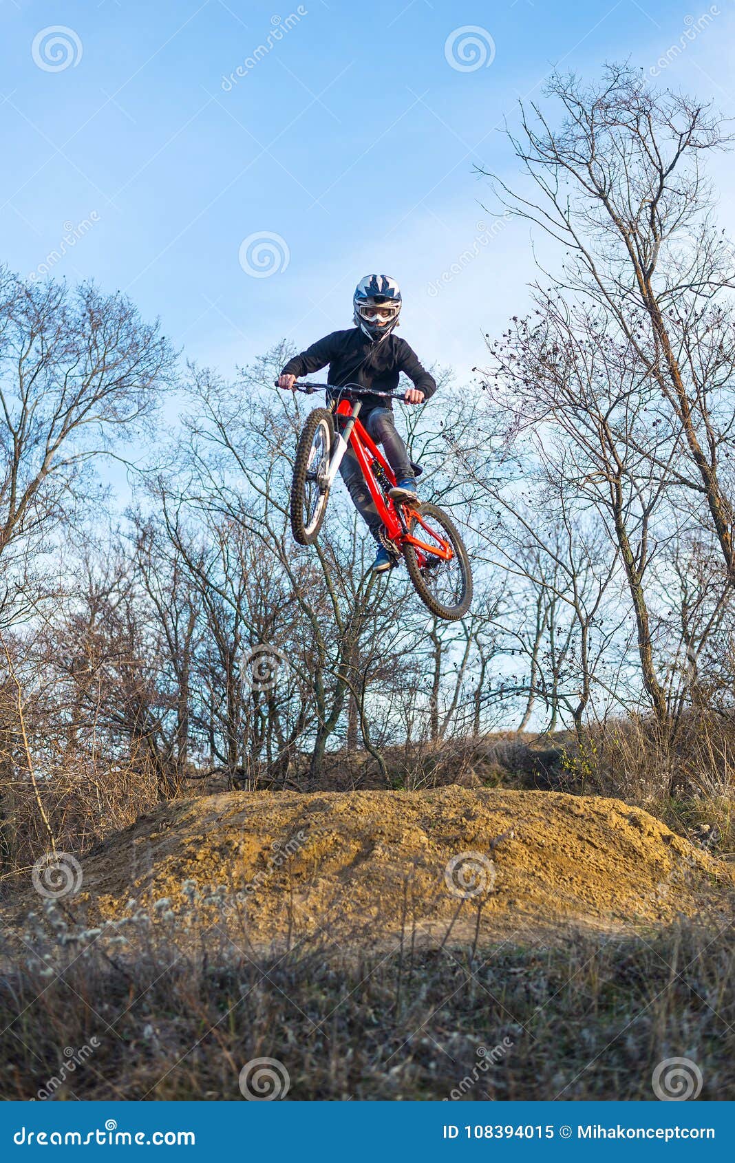 Rider is Jumping on a Mountain Bike, an Extreme Sport. Stock Image ...