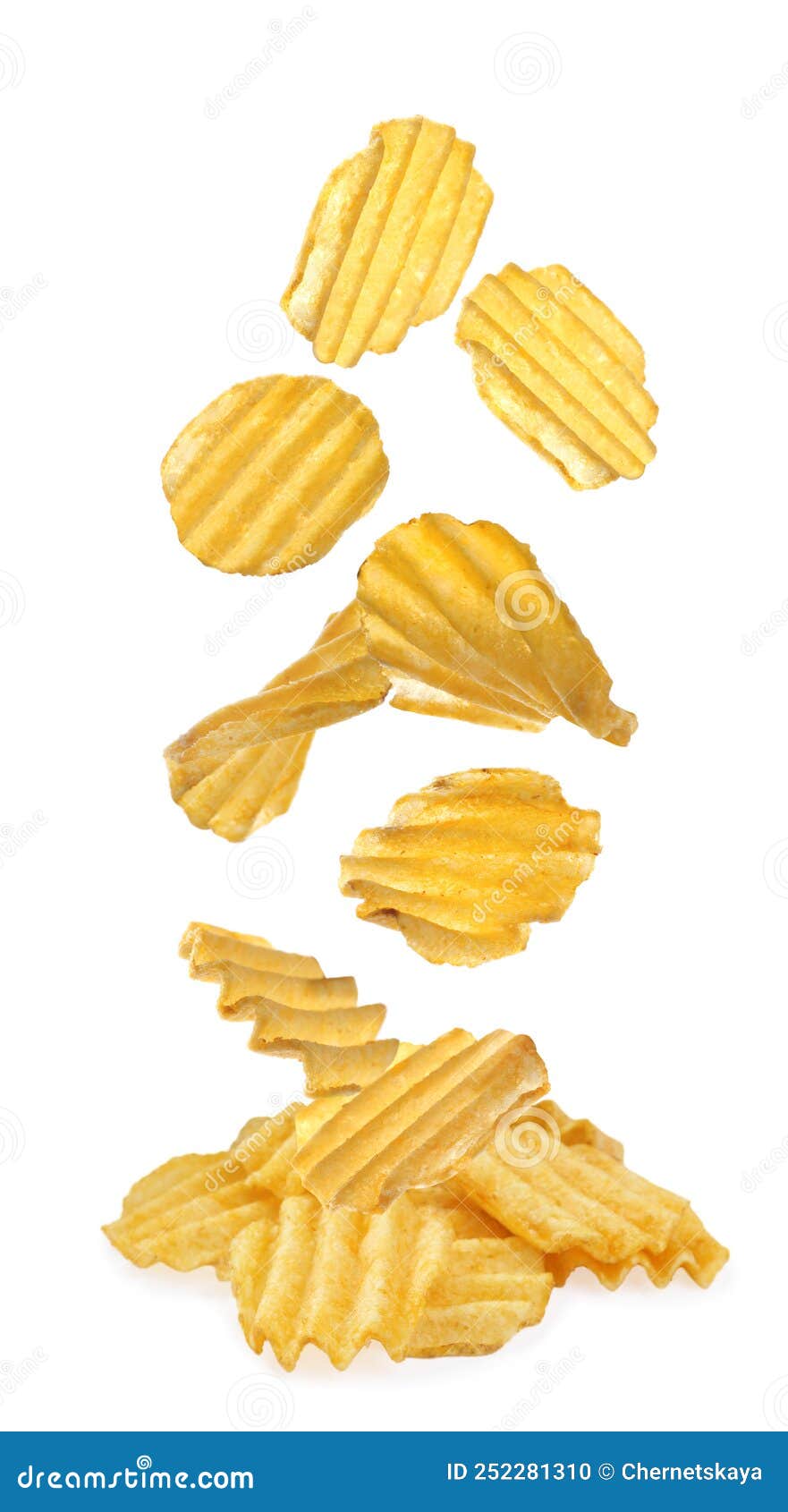 Ridged Crispy Potato Chips Falling into Heap on White Background Stock