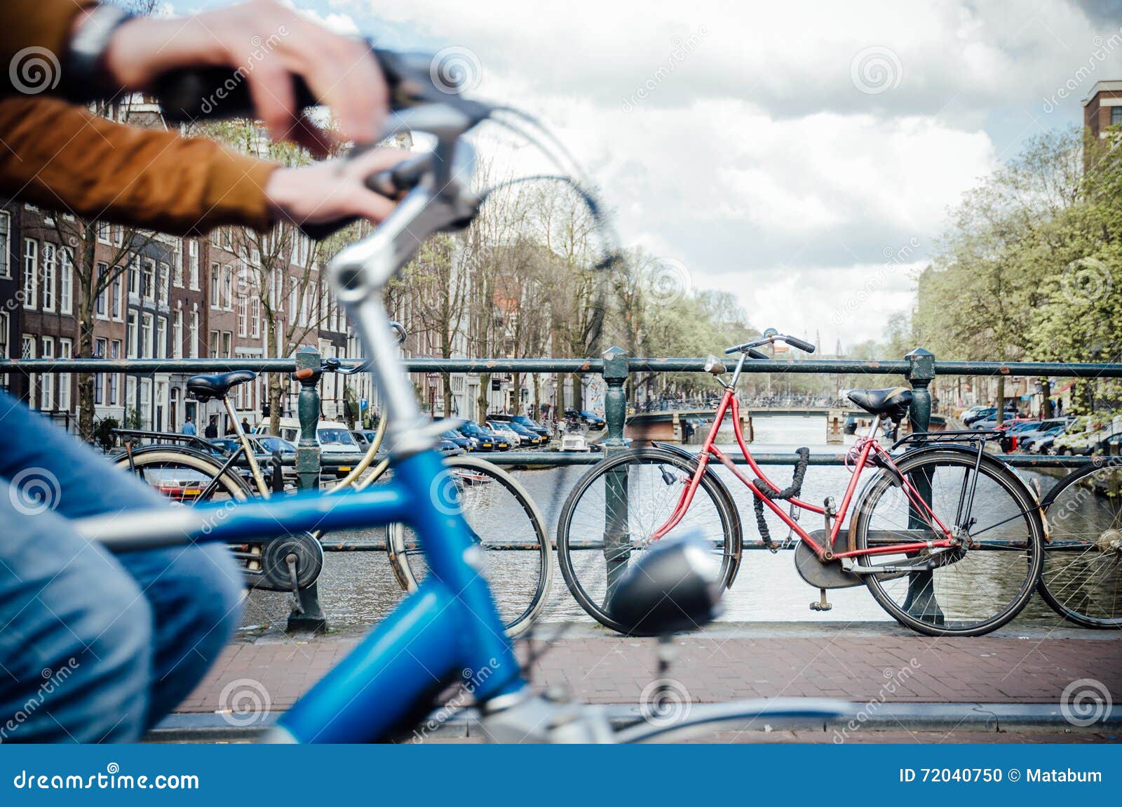 Riding bike in Amsterdam stock photo. Image of transport 72040750