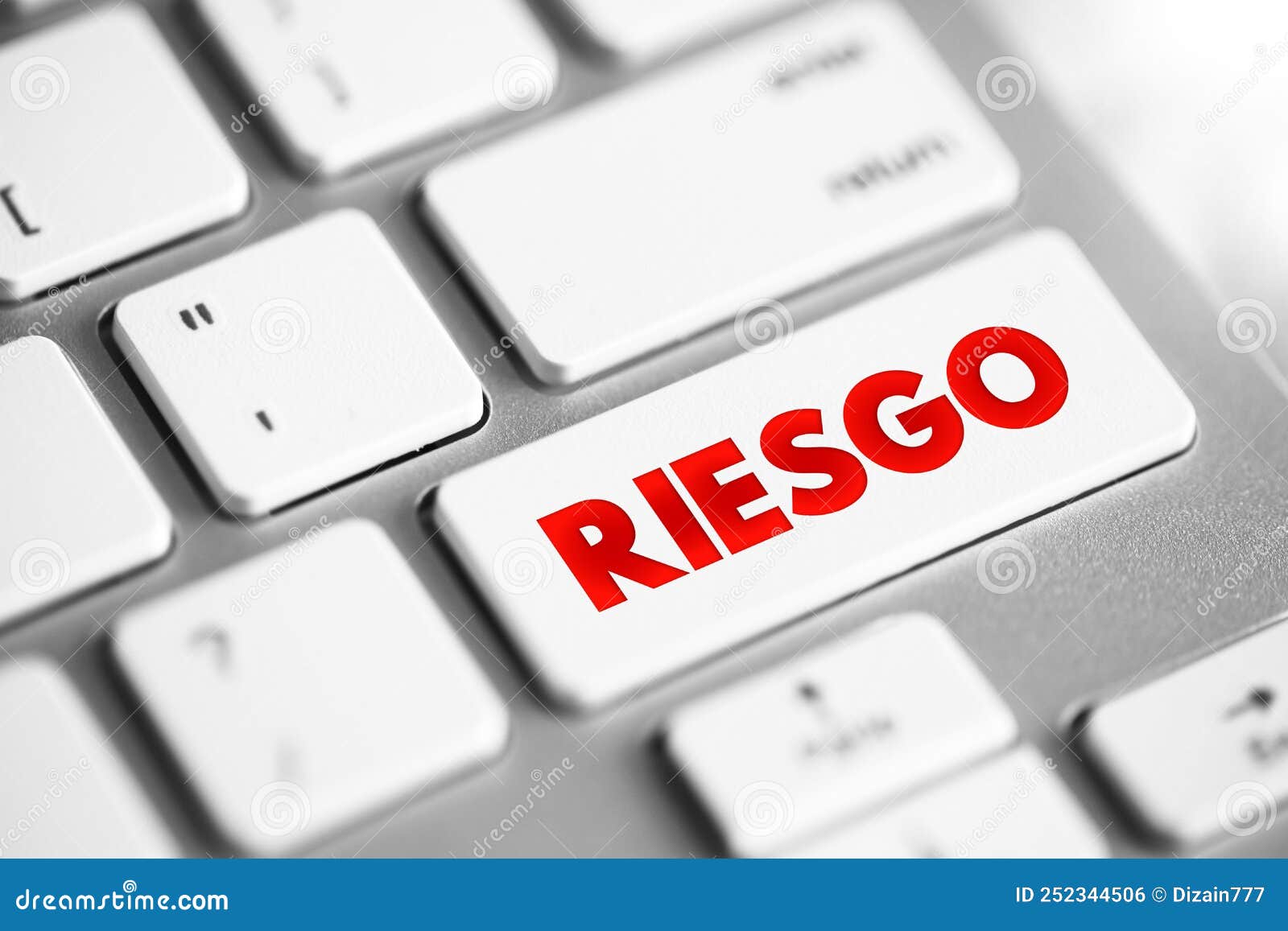 riesgo spanish words for risk text button on keyboard, concept background