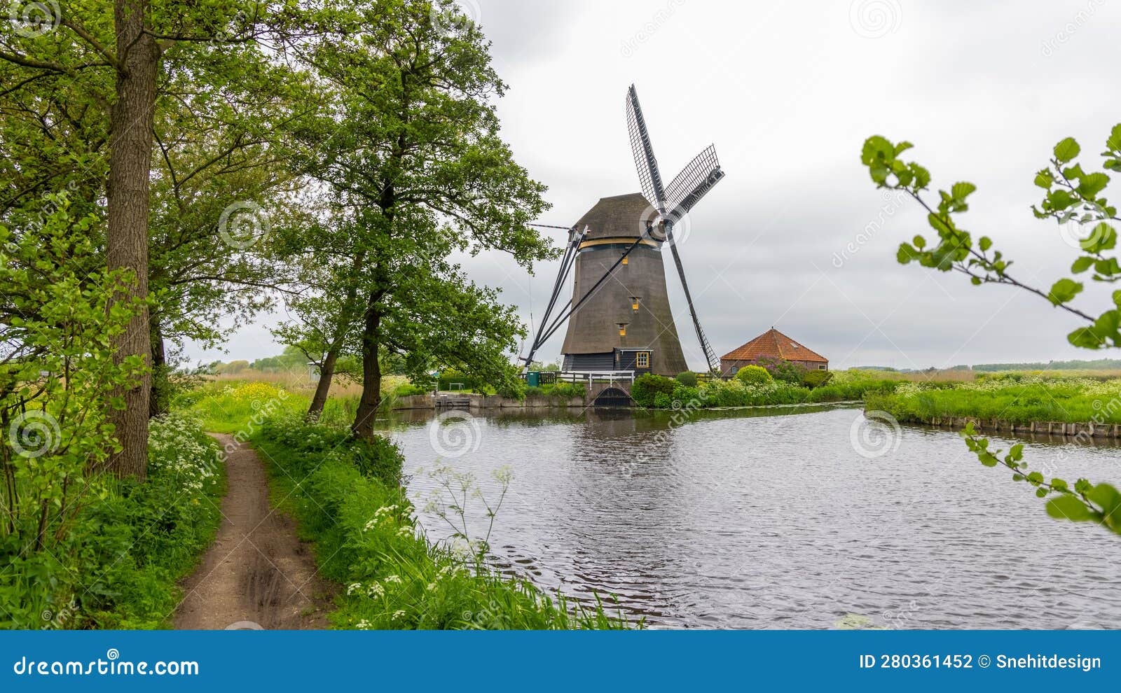 rietveldse molen, is a historic wind mill by the canal, located near zoetermeer in the netherlands