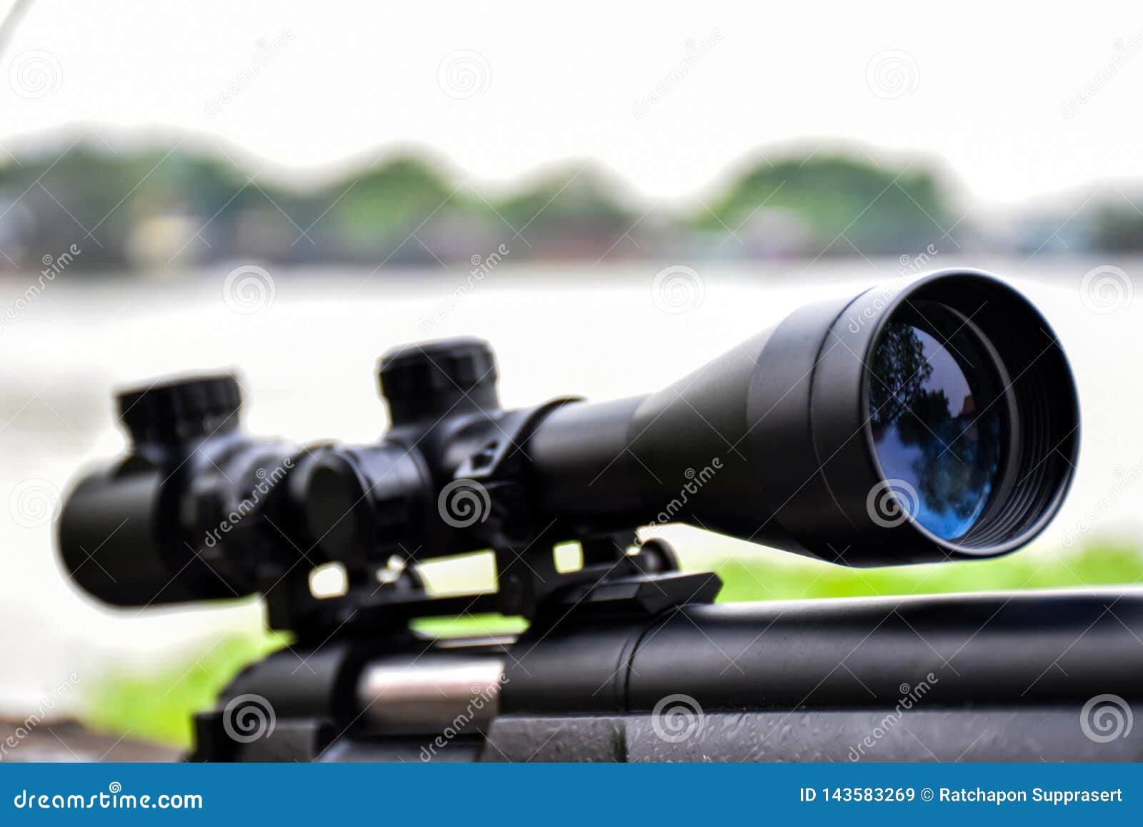 rifle with a scope and bipod