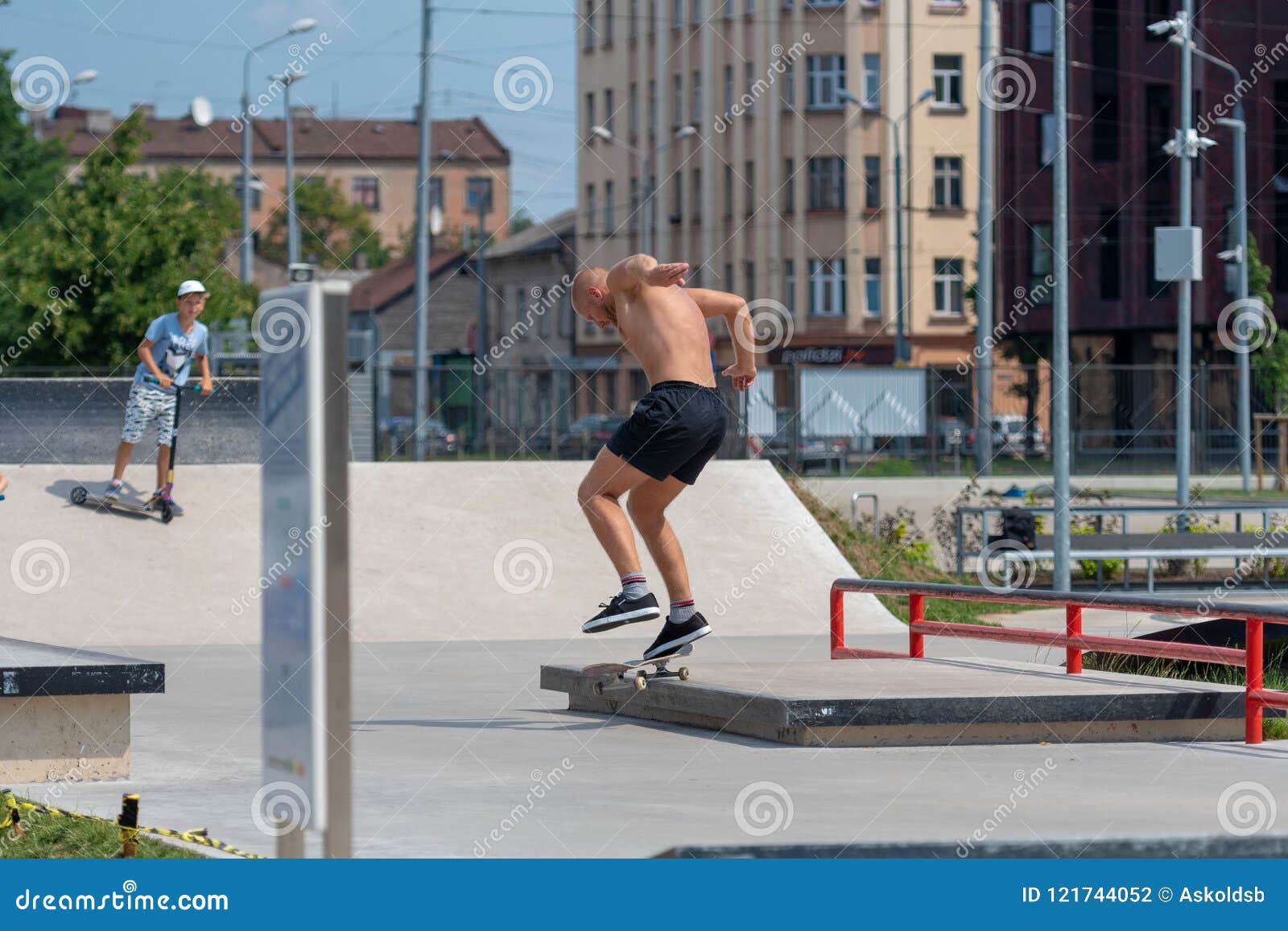RIGA, LATVIA JULY 20, 2018 a Man in a Skatepark Performs Various