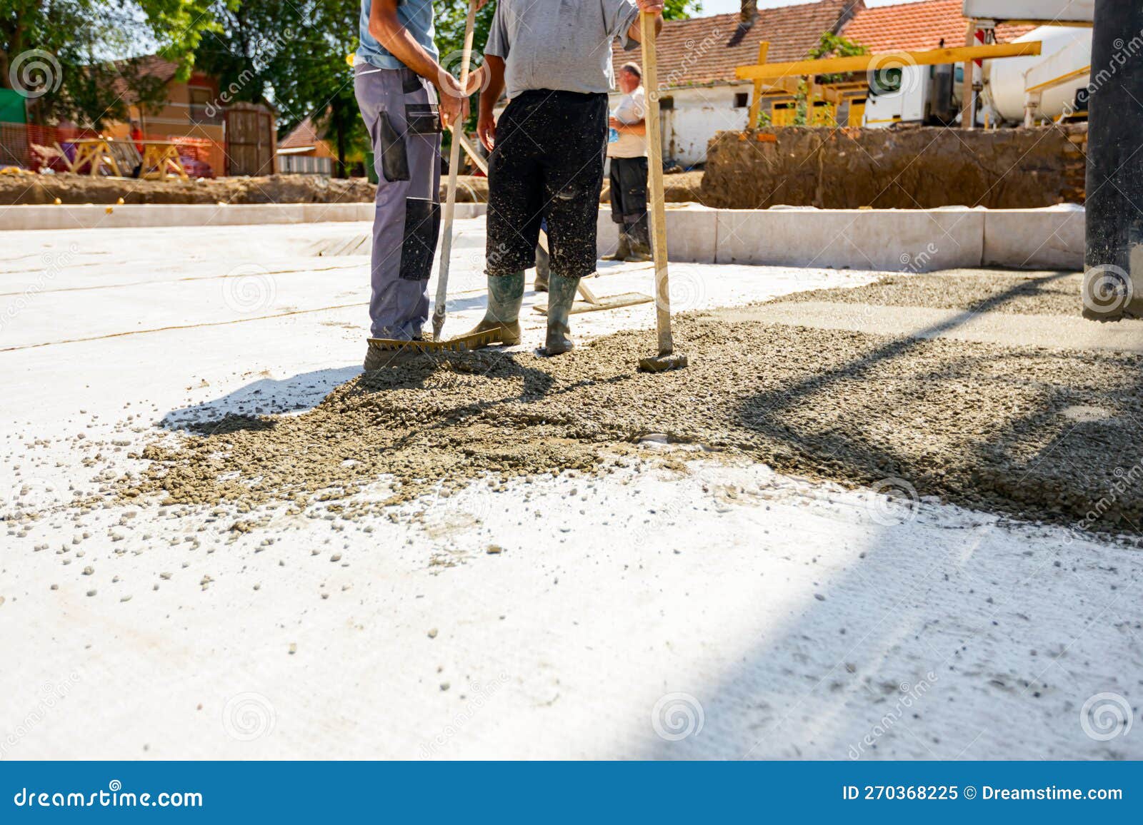 Riggers, Workers Use Rake and Handmade Wooden Tool To Level Fresh