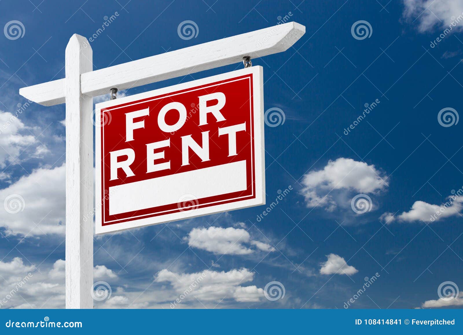 right facing for rent real estate sign over blue sky and clouds