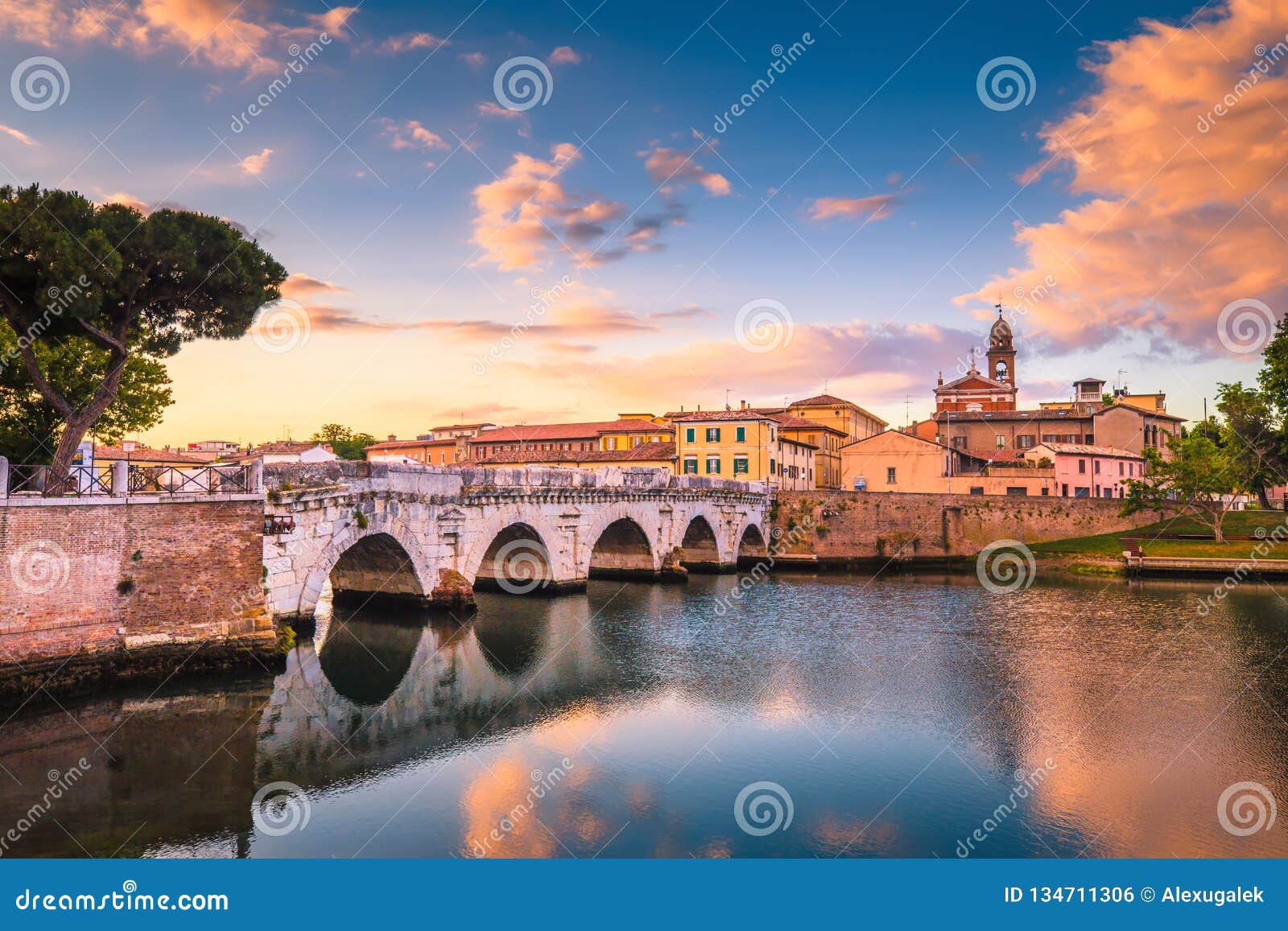 rimini cityscape. tiberius bridge famous sightseeing in rimini at dawn.