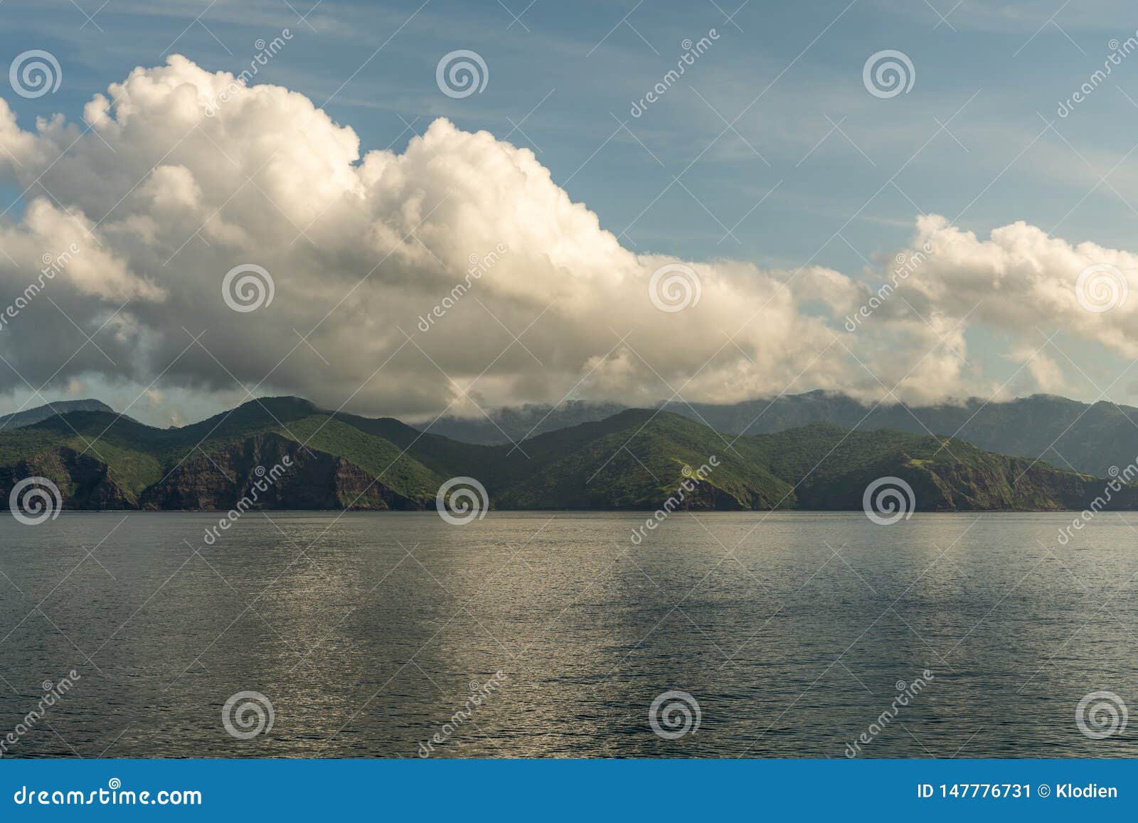 rinca island southside coast and cloudscape, indonesia