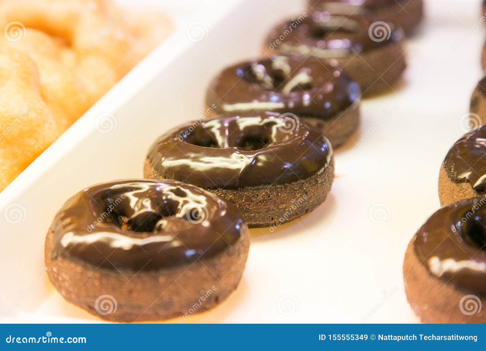 Ring Doughnut Fresh from the Bakery with Sprinkle Sweets and Icing on