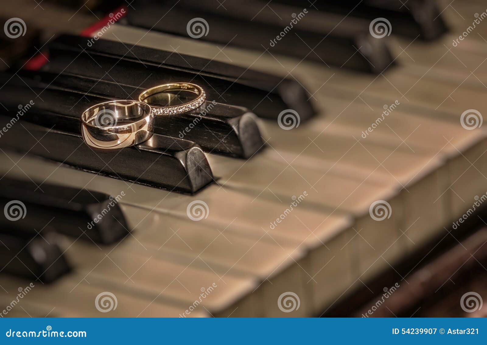 Rings on piano stock image. Image of gold, luxury, circle 54239907