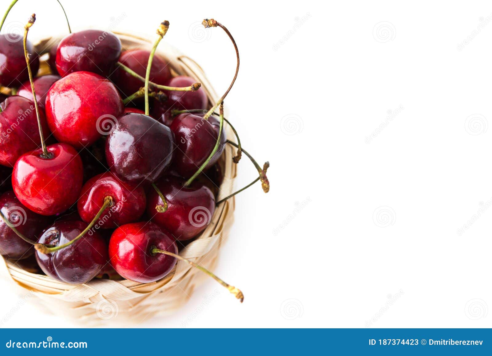 Ripe Cherry Berries in the Basket Isolated on the White Background. Top