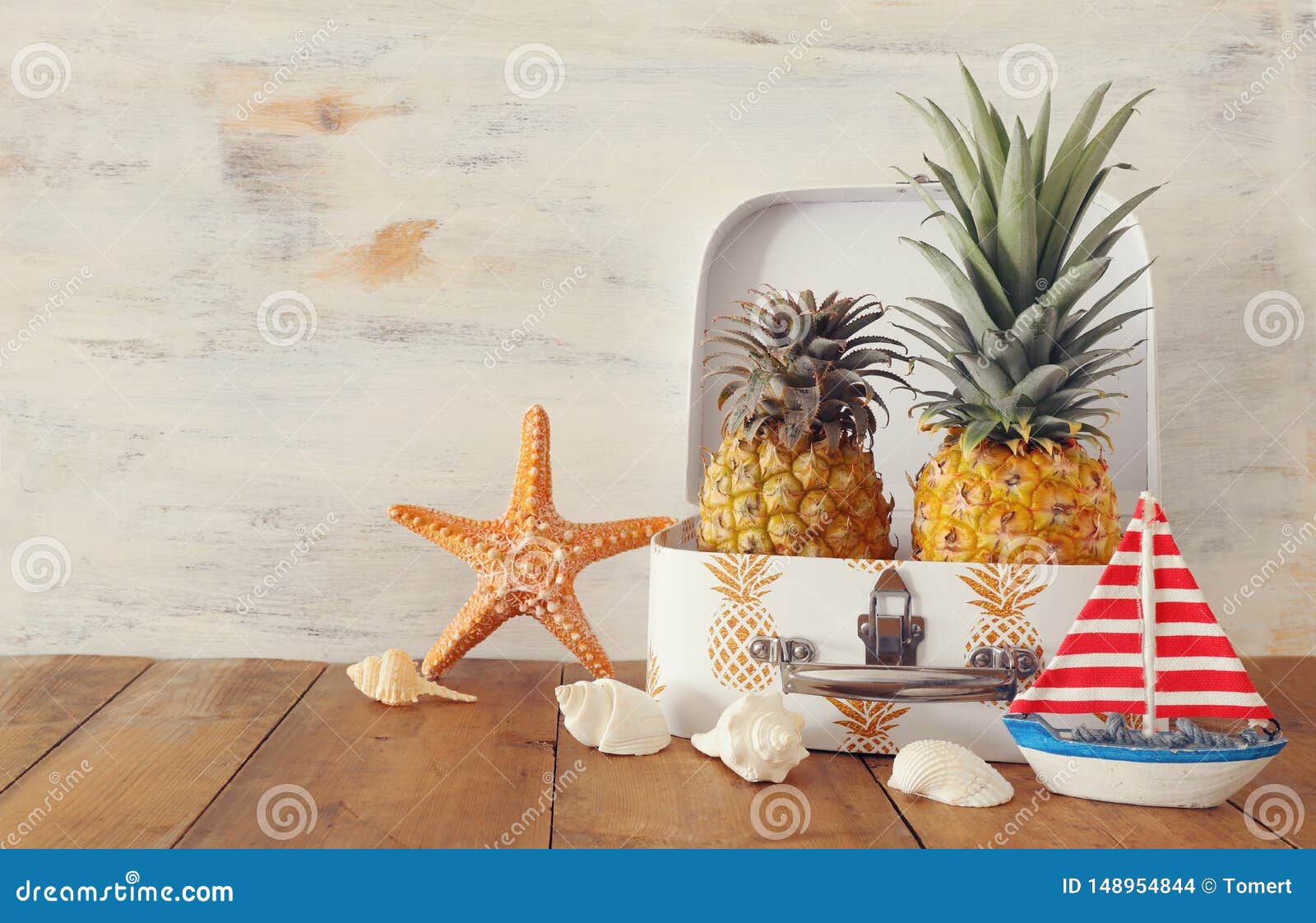 Ripe Couple Pineapple in Suitcase Over Wooden Table or Deck. Tropical ...