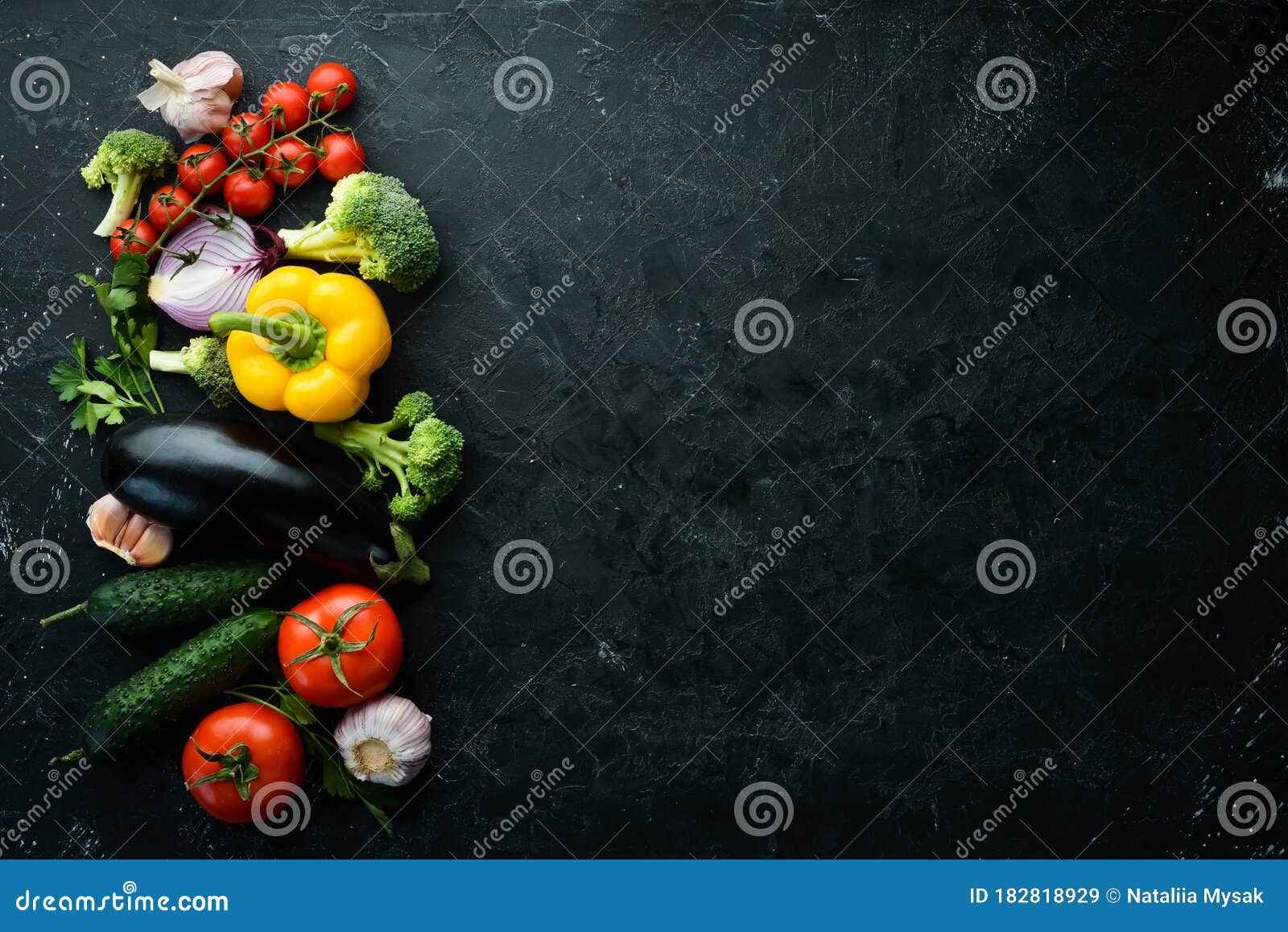 ripe vegetables. fresh vegetables on black stone background. tropical fruits. top view.