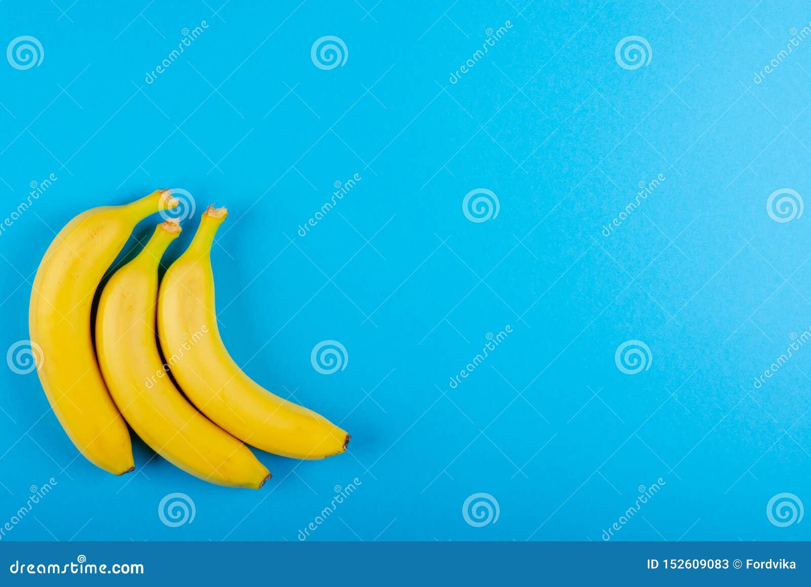 Three Bananas on a Blue Background Stock Image - Image of idea ...