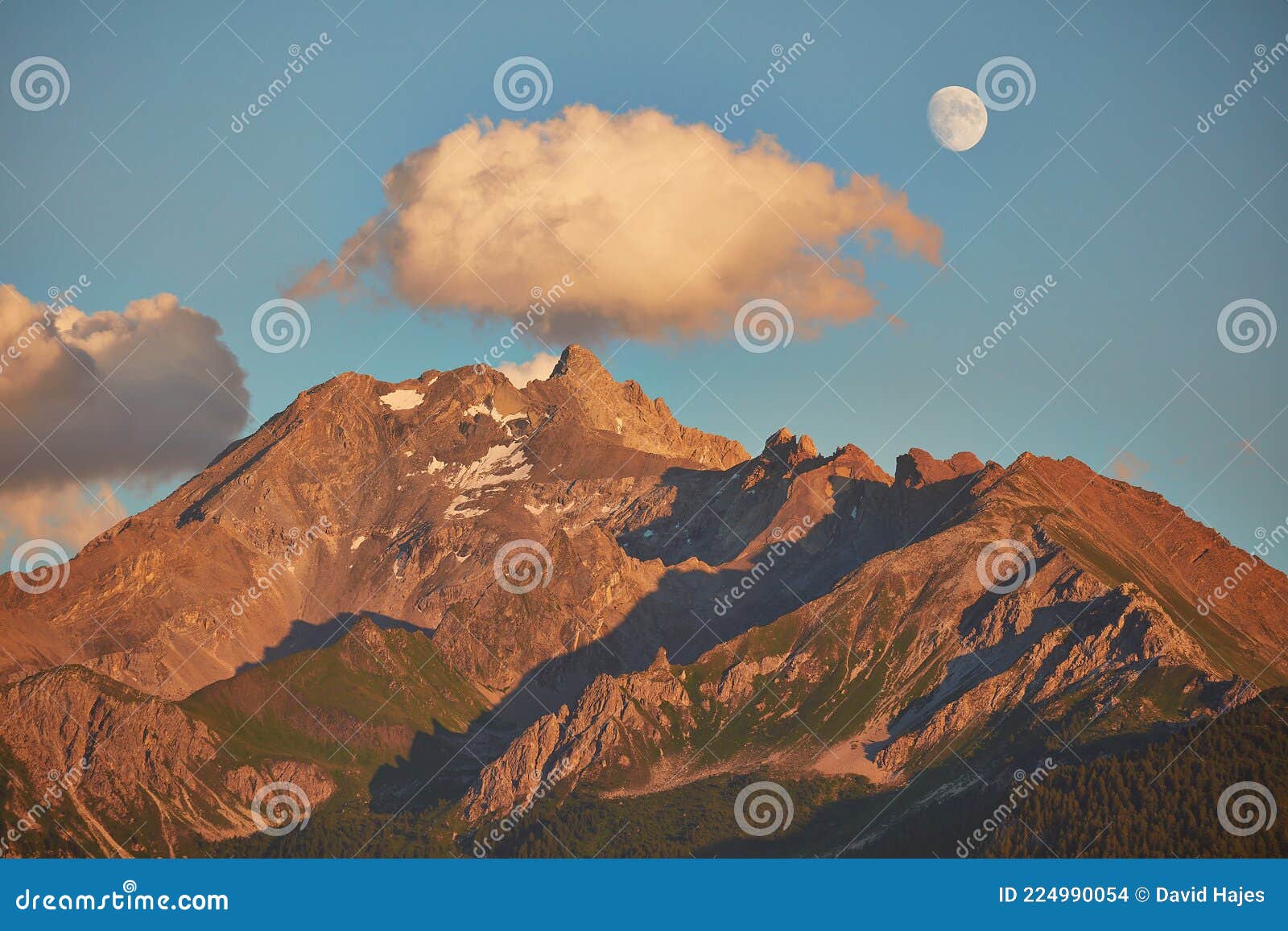 rising moon and setting sun over piz mitgel massif
