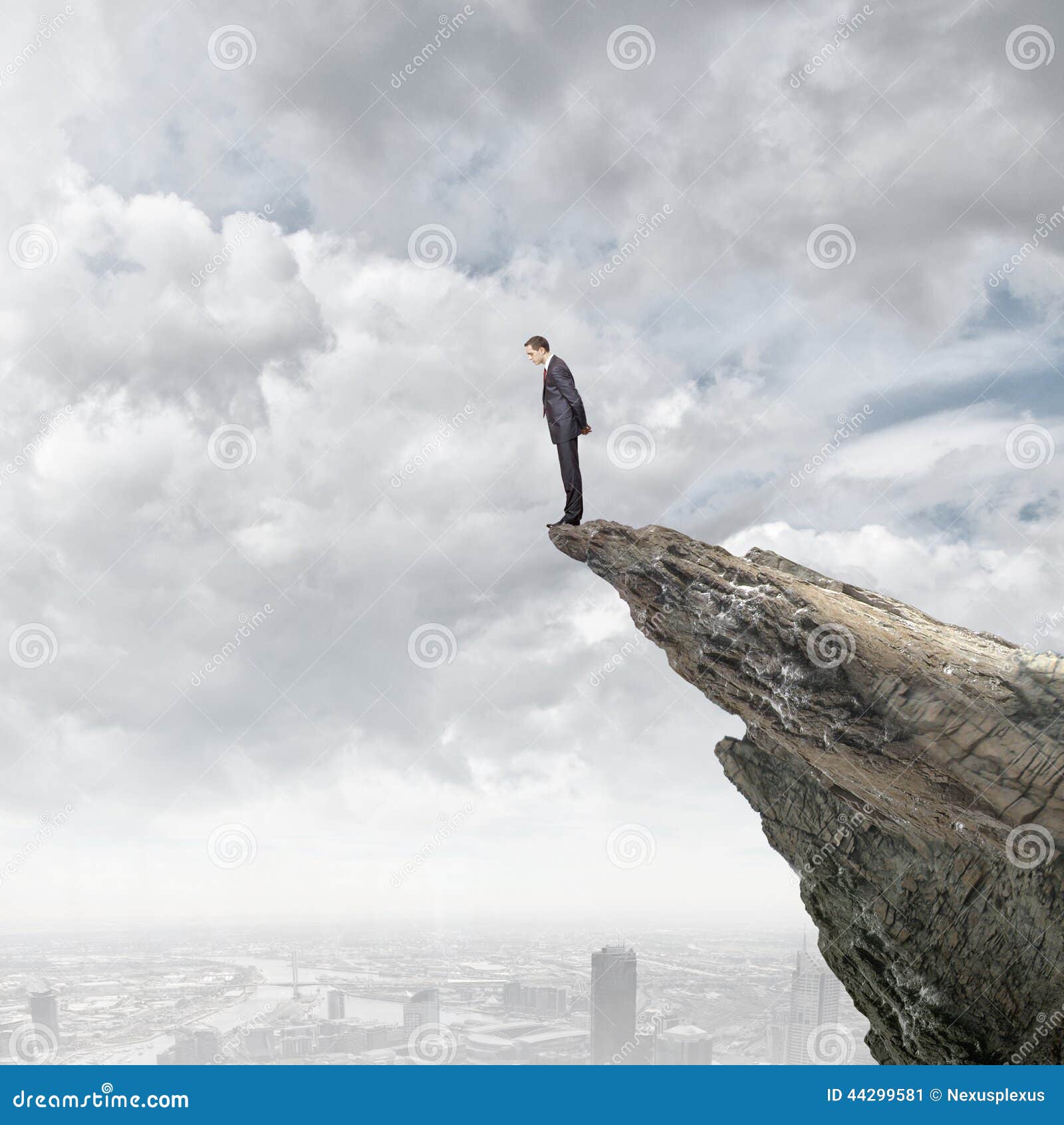 Man On The Edge Of A Cliff Stock Photo - Download Image Now