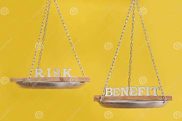 Risk Vs Benefit in Balance. Concept of Equilibrium. Balance Scales on
