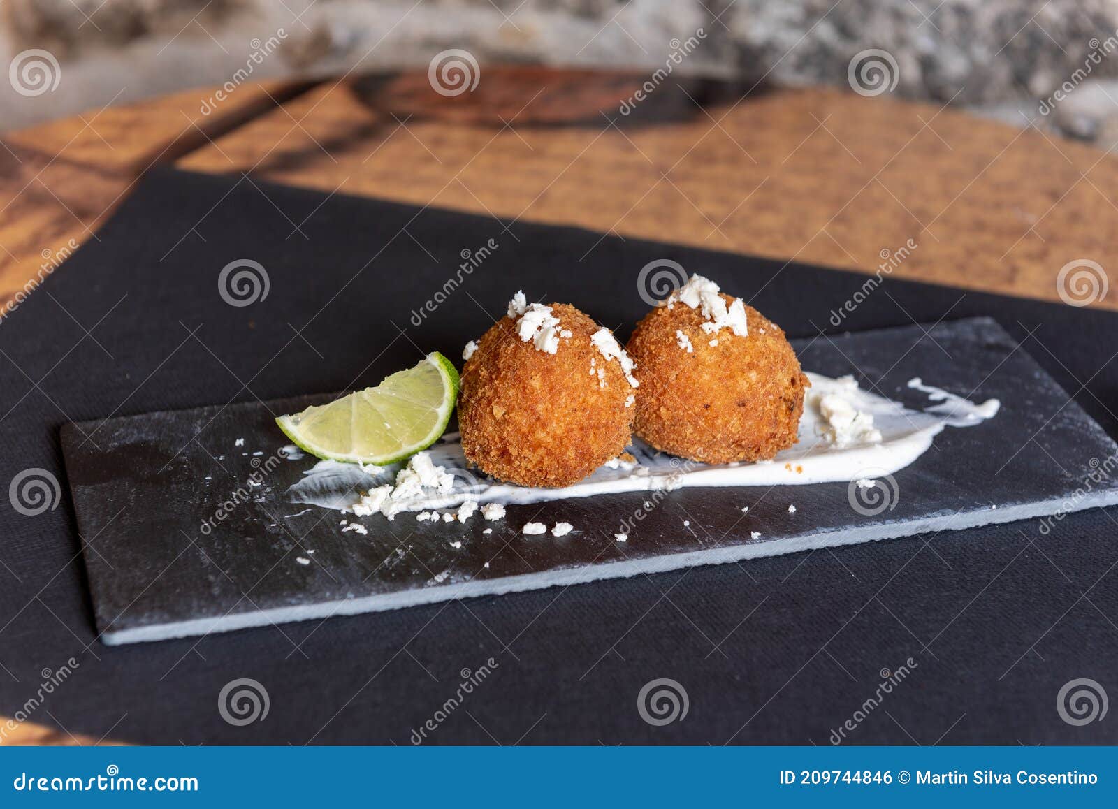 Risotto and Xipotle Arancini in Black Plate Stock Photo Image of