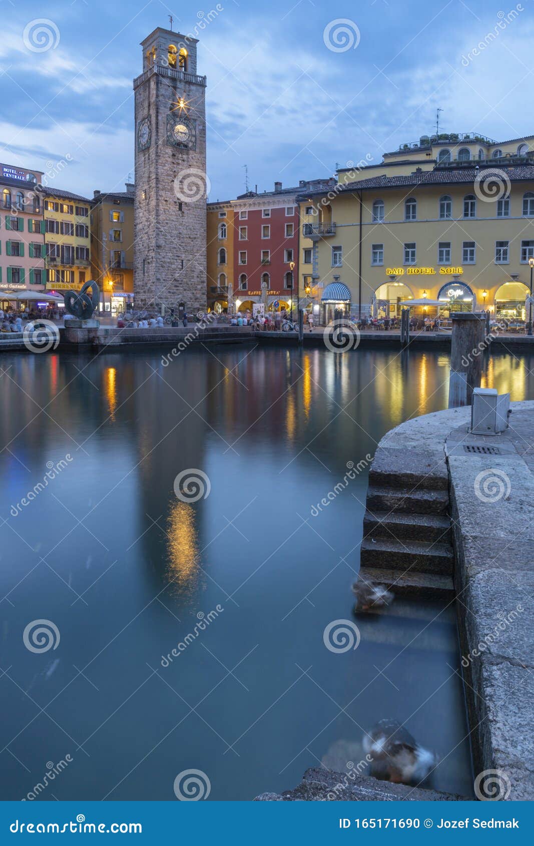 RIVA DEL GARDA, ITALY - JUNE 6, 2019: the City from South with the Alps ...