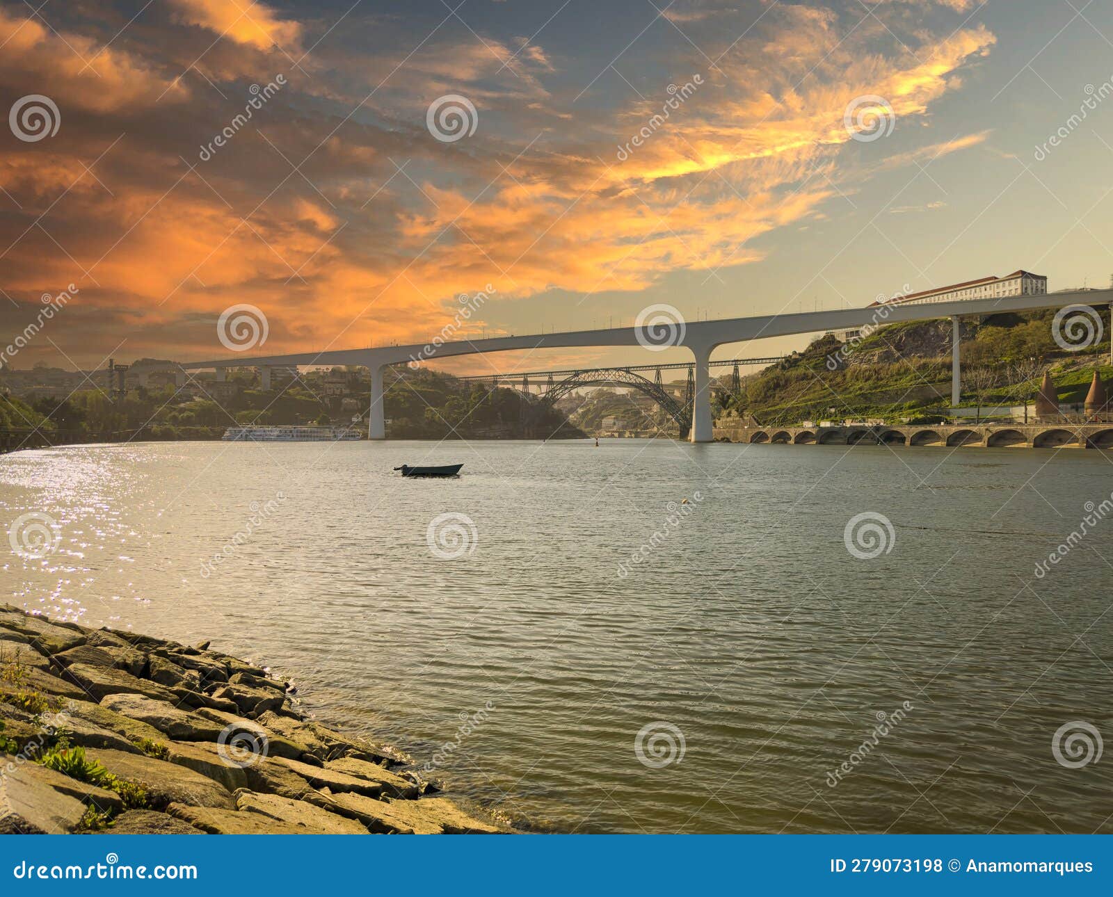 river beach of areinho on the bank of gaia on the douro river at sunset. portugal