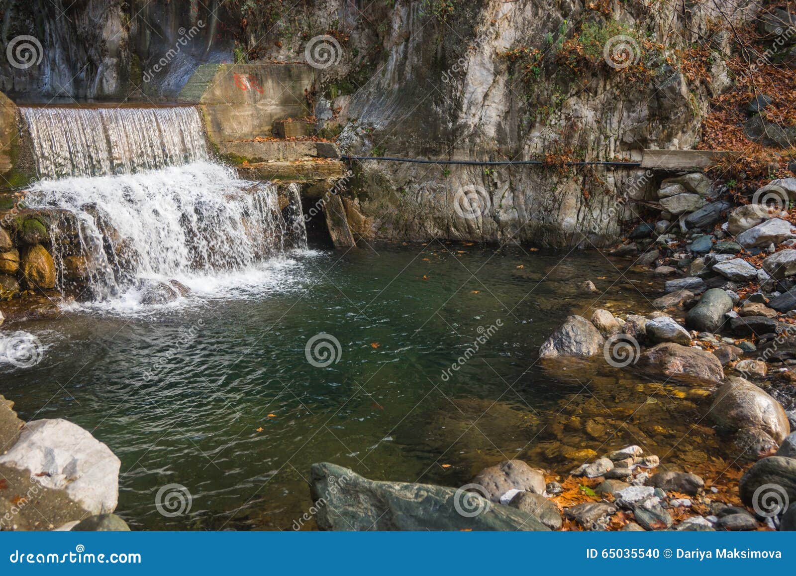 river with colored stones and hot springs in loutra pozar, north