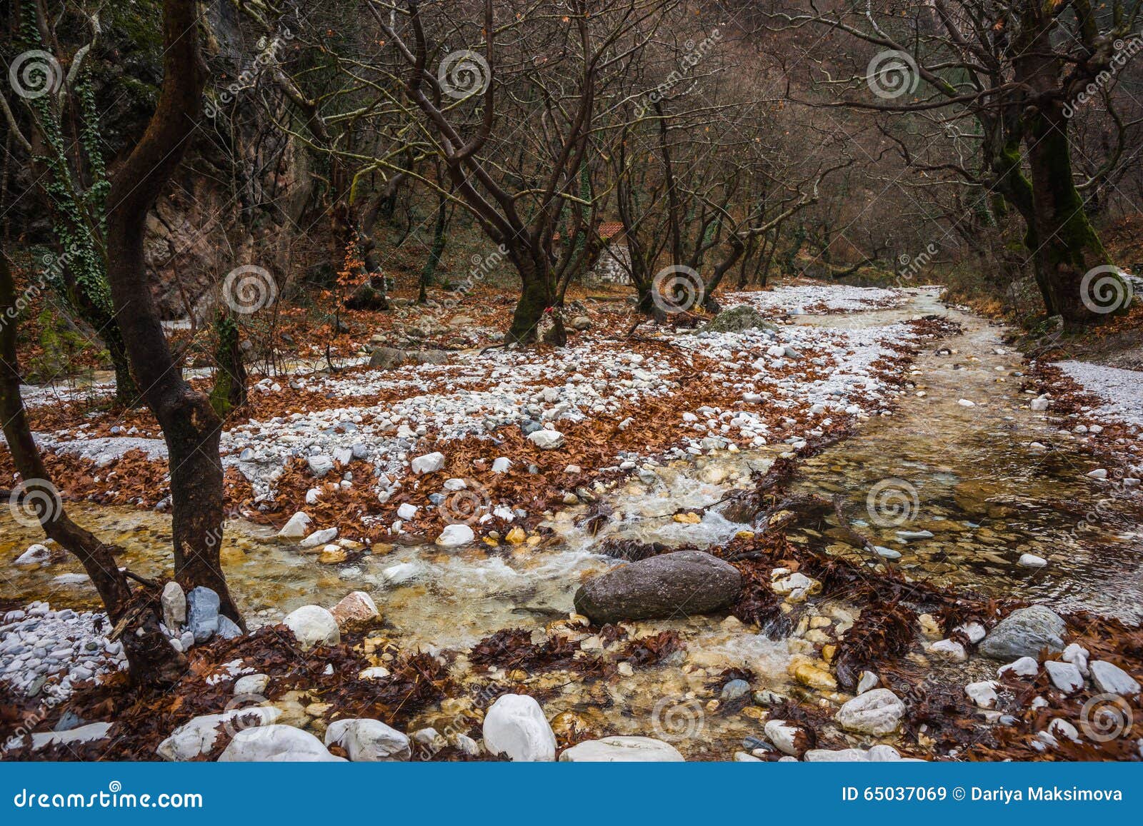 river with colored stones and hot springs in loutra pozar, north