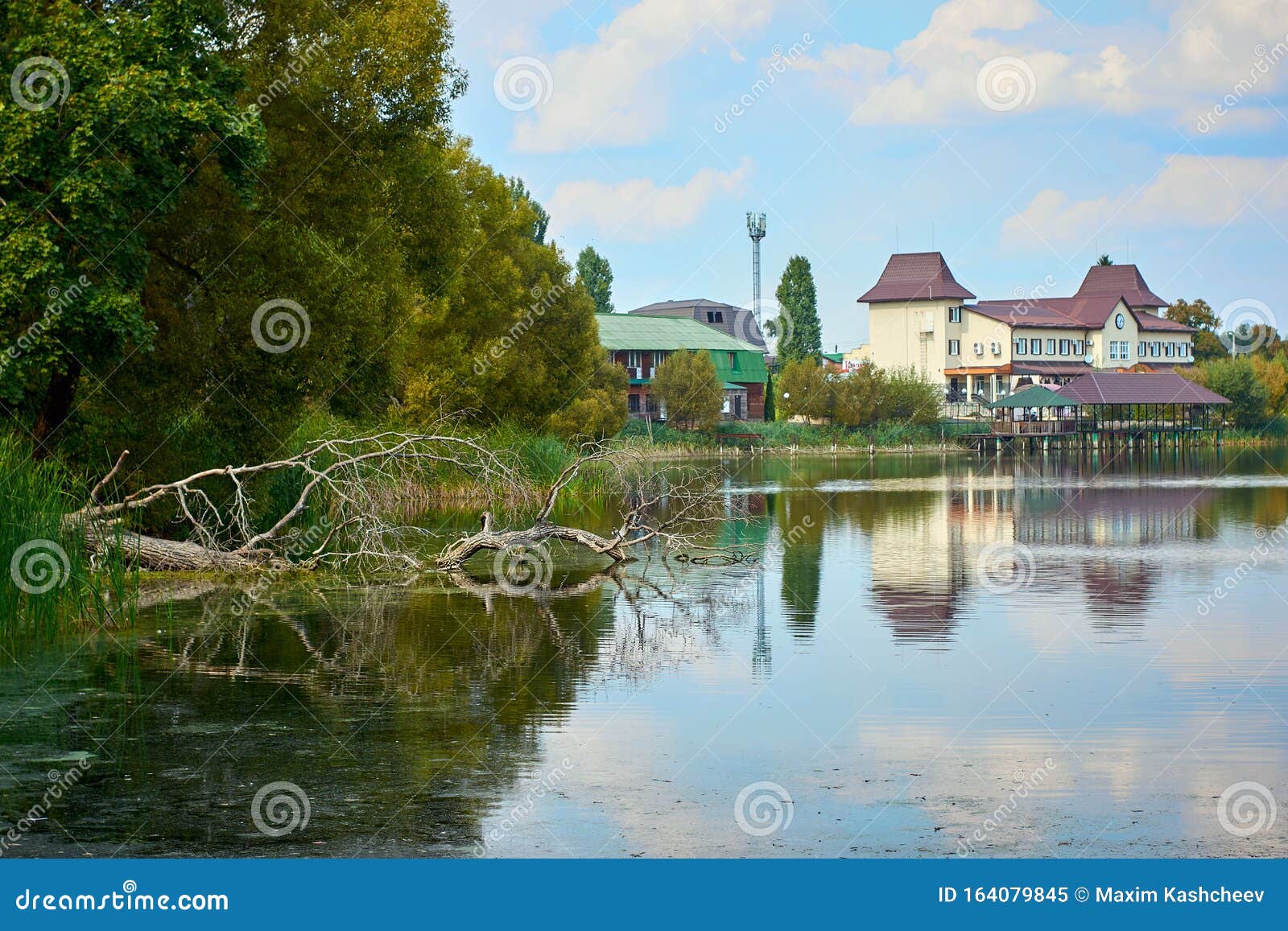 River House with Reflections and Blue Sky Near the Forest Stock Image ...