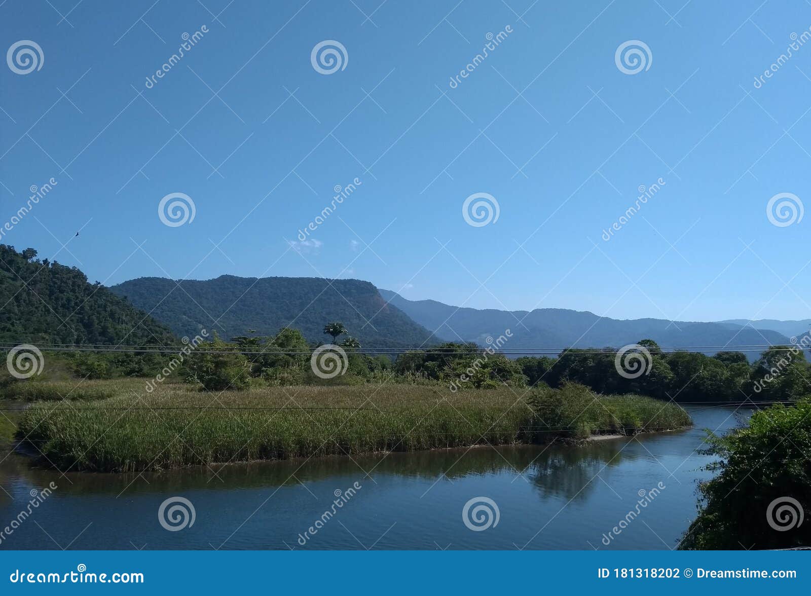 river with mountain, and blue sky background.