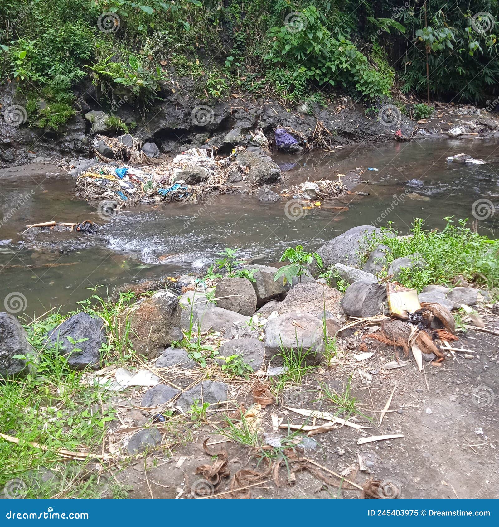 The River is Polluted by River Waste in the East Lombok Area Stock