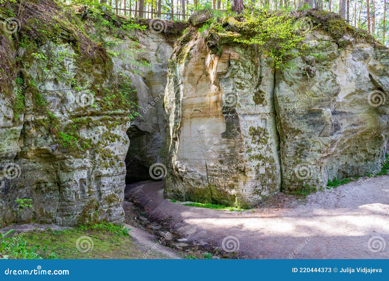 river stream from cave. fragment of sandstone cliff big elita