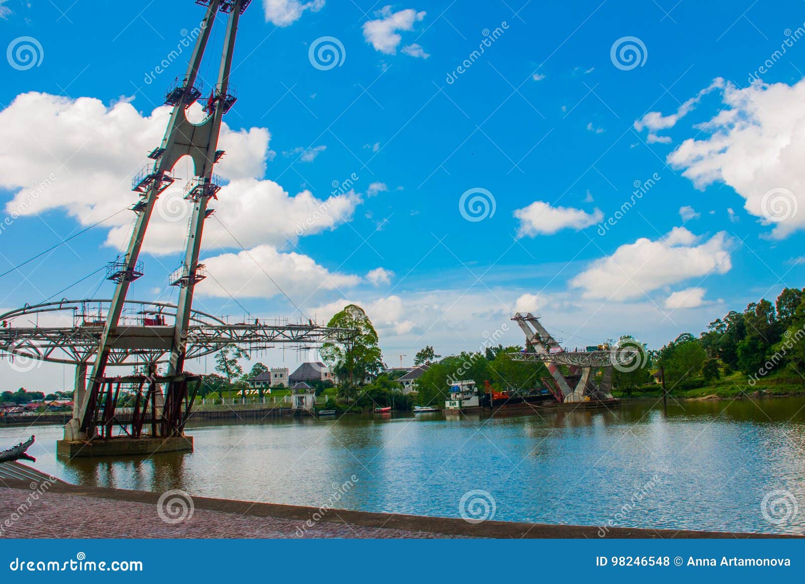 river, where a new bridge. the astana, or governor`s palace. kuching. sarawak. malaysia. borneo