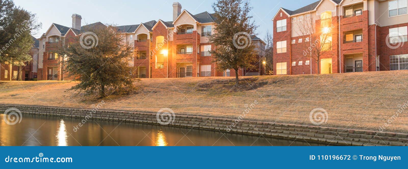 Riverside Apartment Building Complex Reflection at Blue Hour Stock