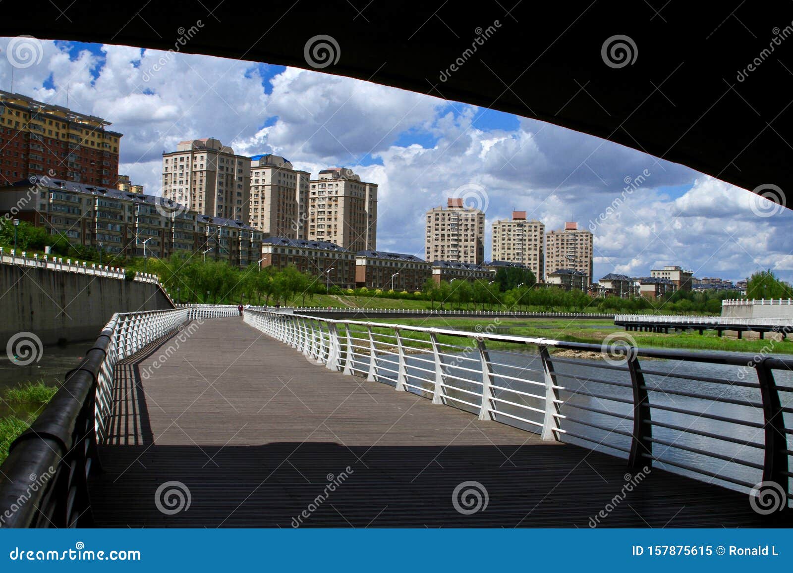 A Riverside Trail with Modern Apartment on the Back Stock Image Image